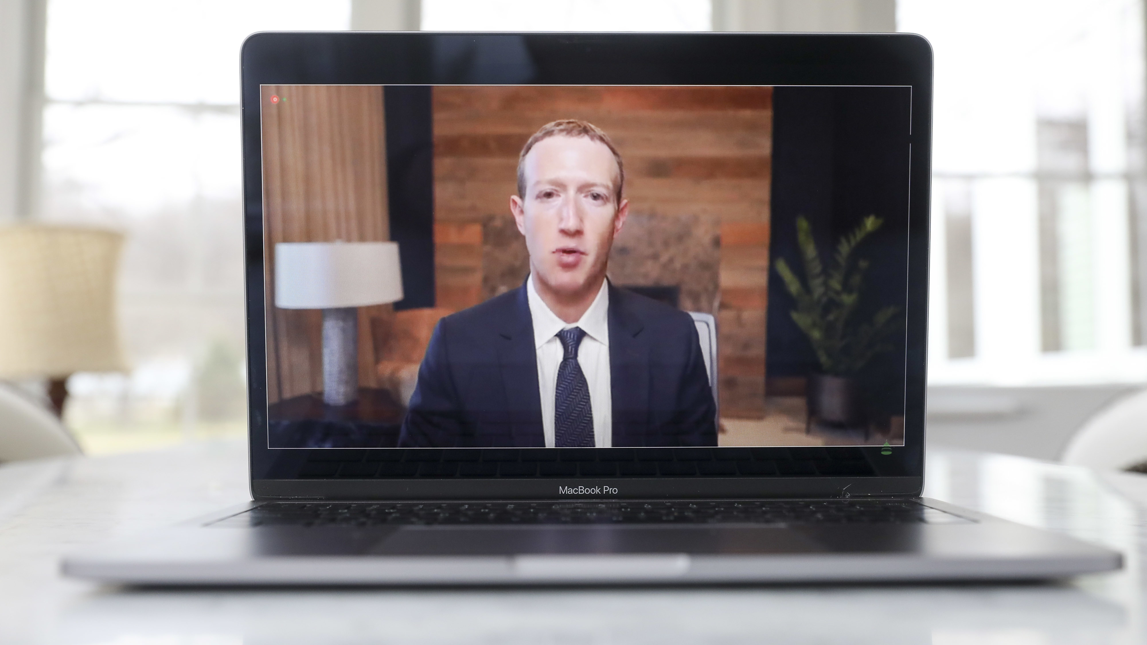 Mark Zuckerberg, CEO of Facebook, speaks virtually during a House Energy and Commerce subcommittee hearing in March. (Bloomberg via Getty Images)