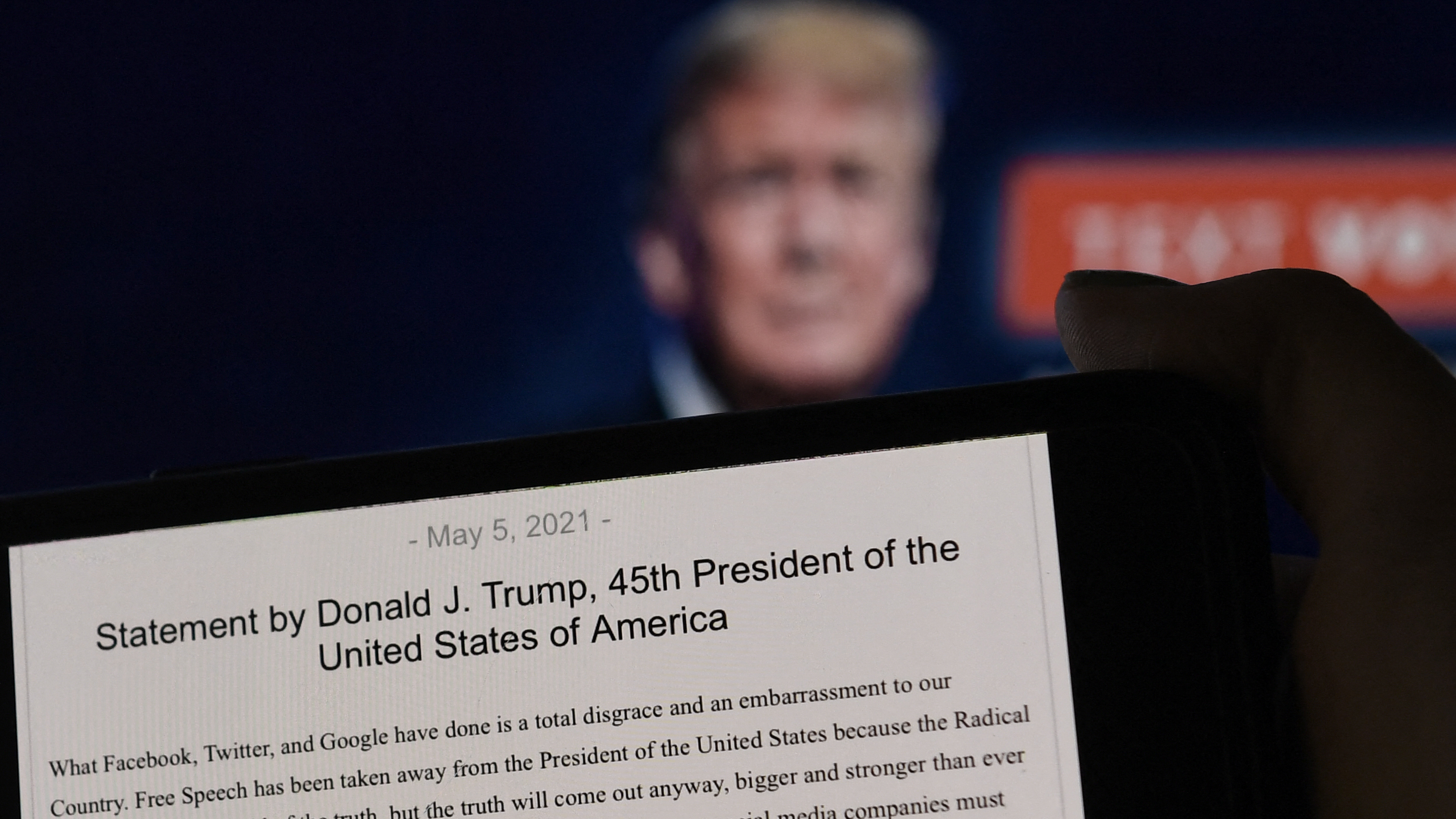 A statement from former President Donald Trump is seen in front of his Facebook page background. Facebook was justified in its decision to suspend Trump after the Jan. 6 insurrection, the company's Oversight Board said Wednesday. (AFP via Getty Images)