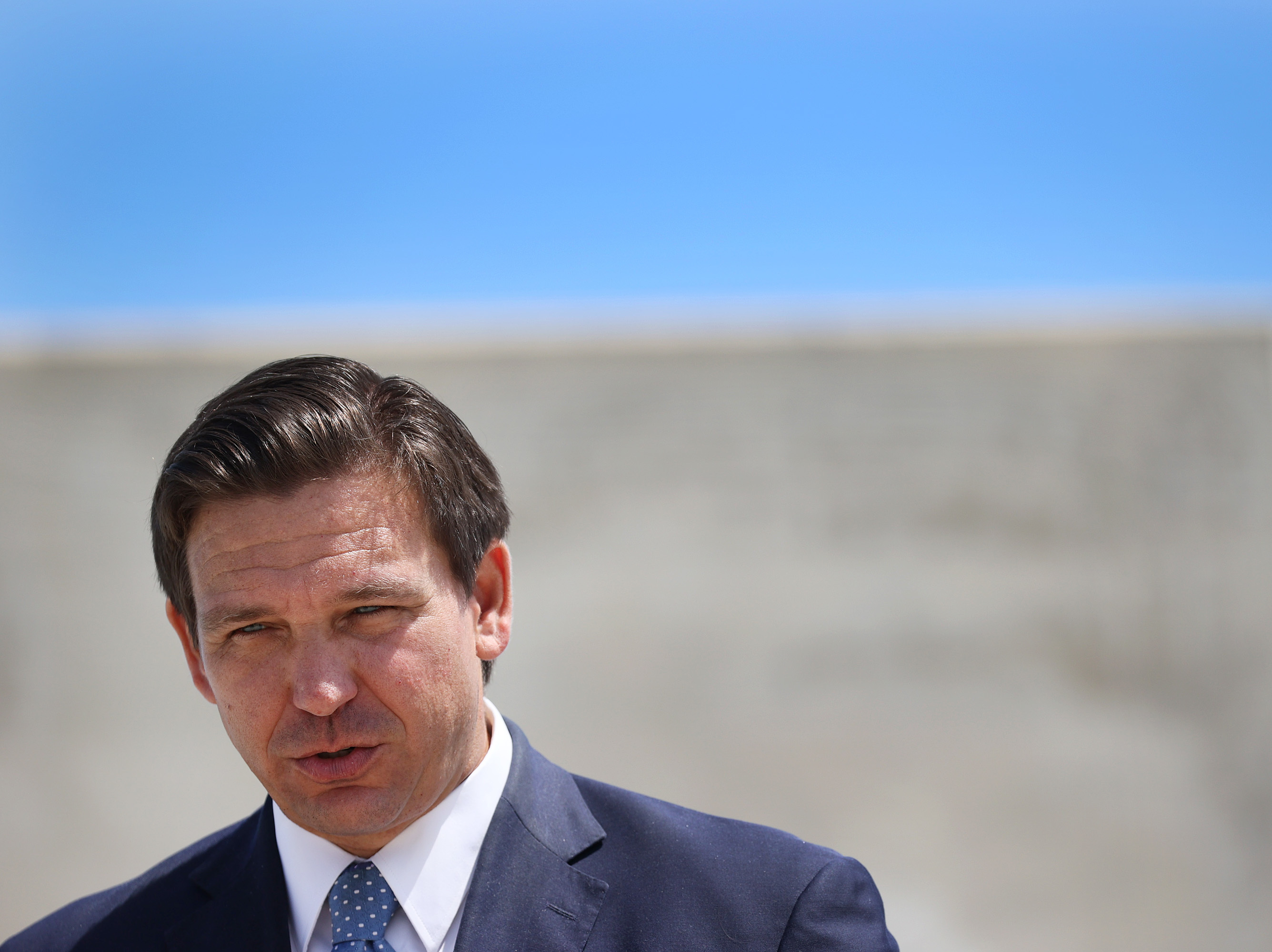 Florida Gov. Ron DeSantis speaks to the media about the cruise industry during a press conference at PortMiami in April. DeSantis faces criticism for failing to do all he could on Florida's biggest environmental threat: climate change. (Getty Images)