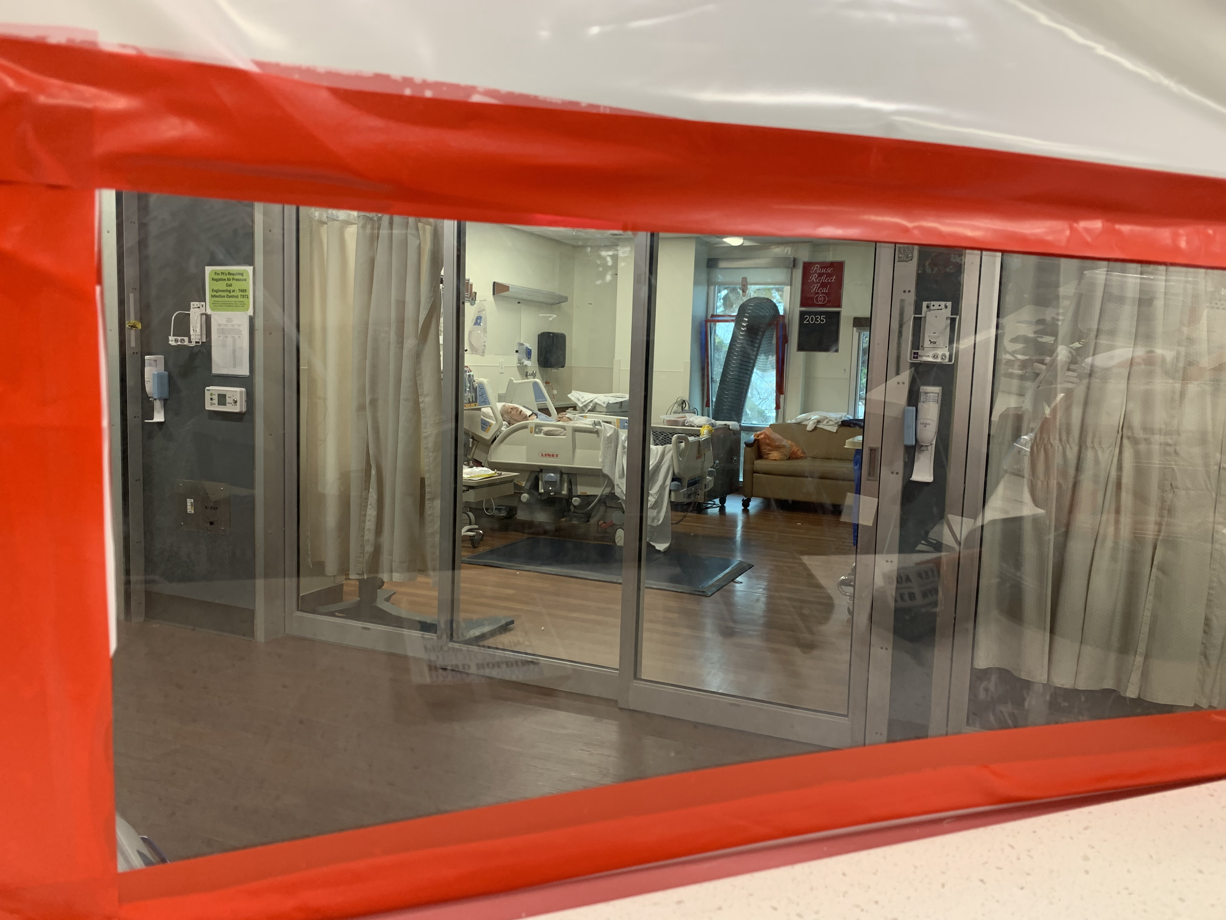 A patient in the COVID-19 ICU at Mercy Hospital of Folsom, Calif. is not allowed visitors. For many months during the pandemic, family weren't allowed to visit any hospital patients. (KQED)
