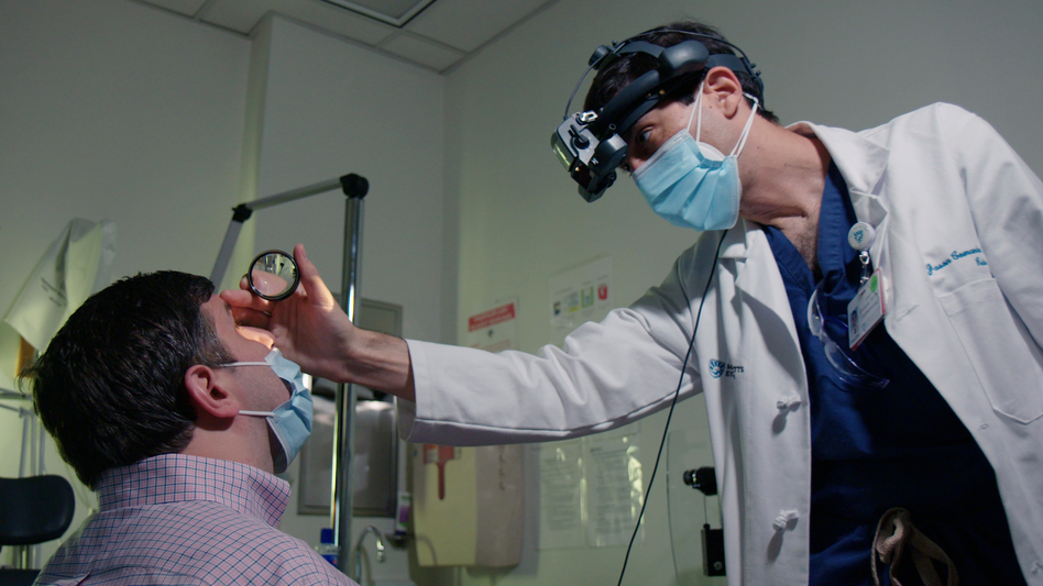 Kalberer visits with Dr. Jason Comander at Mass Eye and Ear in Boston. Doctors are comparing the vision of patients before and after the procedure, and between their treated and untreated eyes, to see if the procedure is helping them see better.
