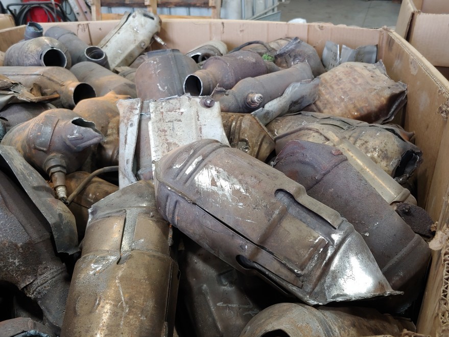 A bin full of discarded catalytic converters at AB CatTech in Burlington, Wis. (WUWM)