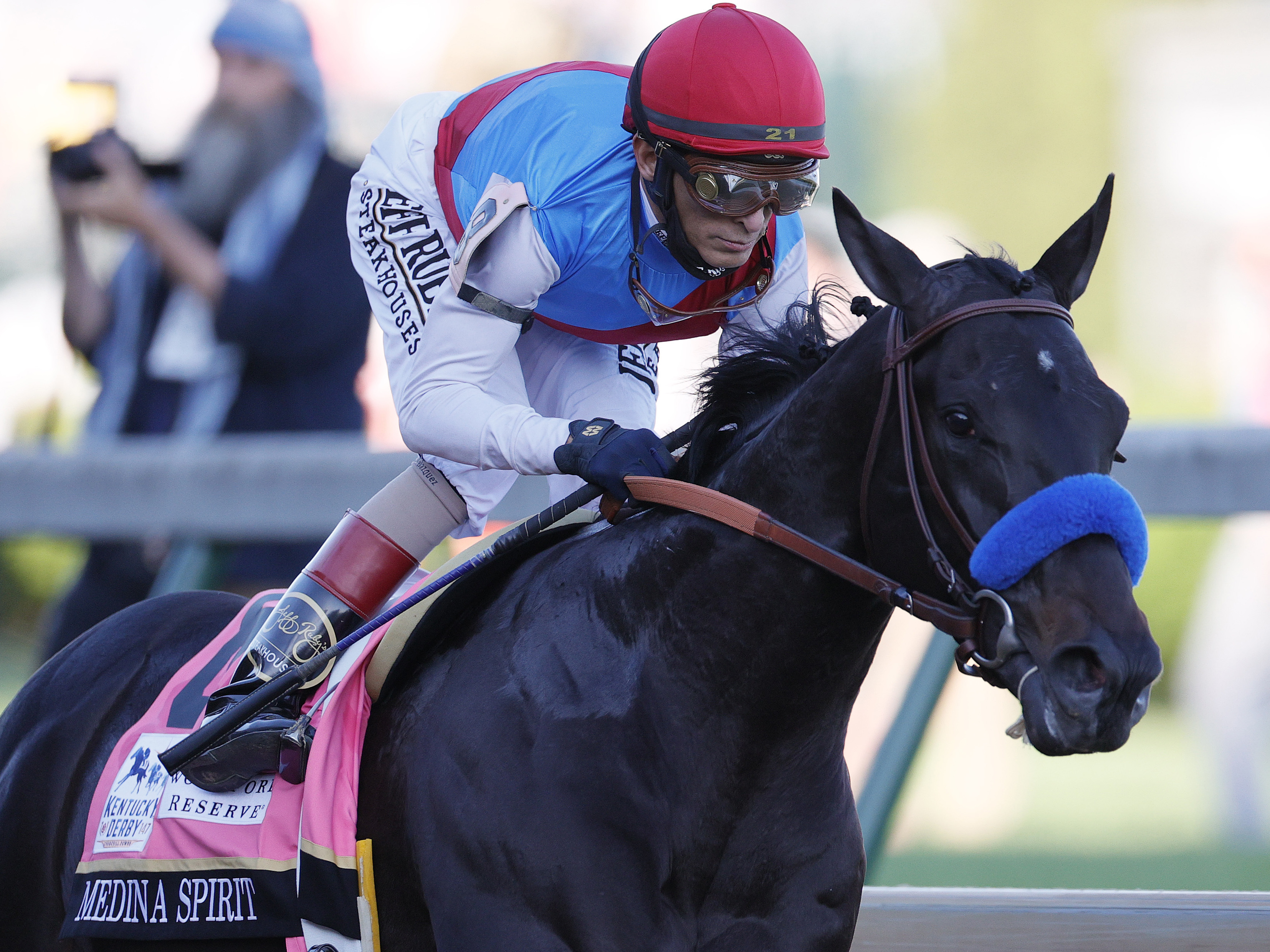 Medina Spirit, ridden by jockey John Velazquez, leads the field  during the Kentucky Derby in Louisville on May 1. On Sunday, trainer Bob Baffert revealed the Derby winner had failed a drug test. (Getty Images)