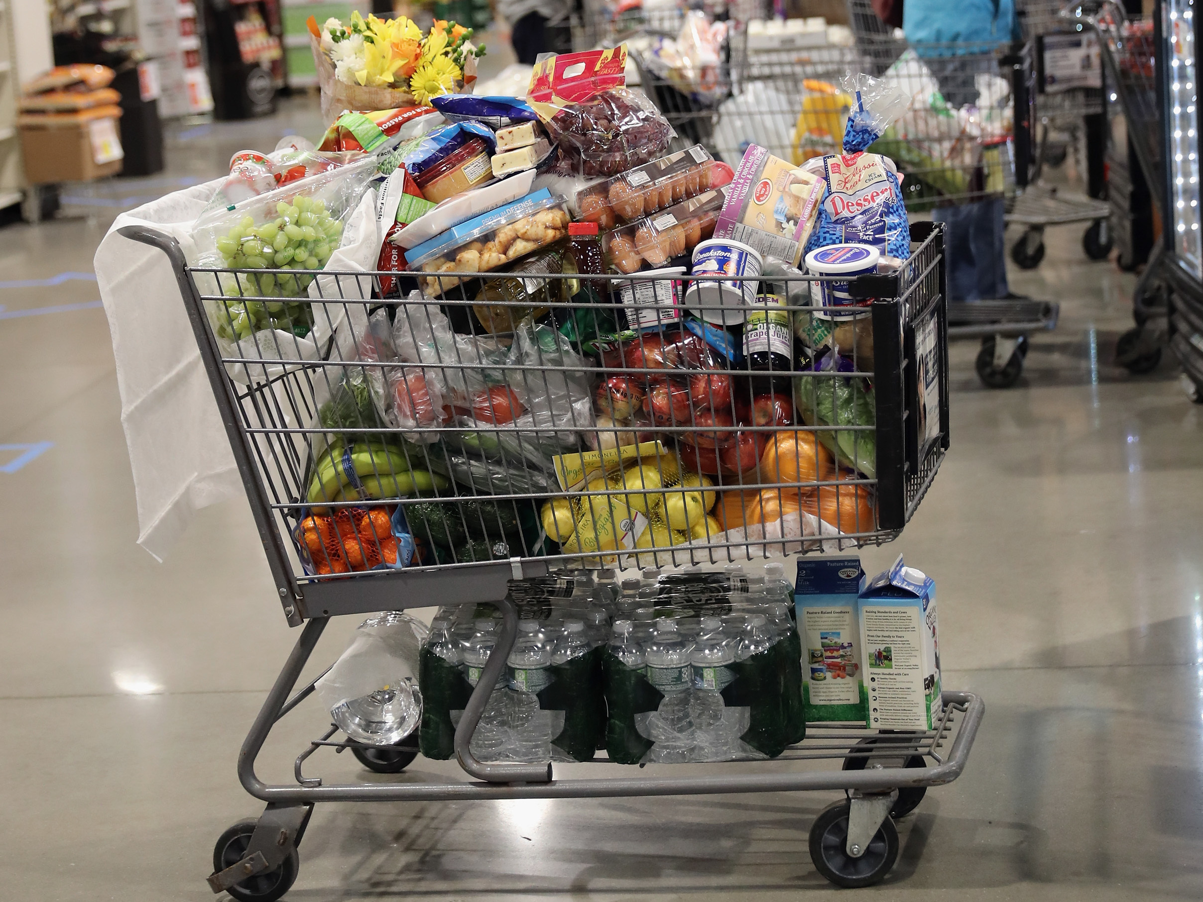 A shopper's cart is full in the checkout line at a ShopRite supermarket in April 2020 in Plainview, N.Y. A year later, prices for most goods have jumped, according to government data, as companies struggle to secure critical raw materials amid supply constraints. (Getty Images)