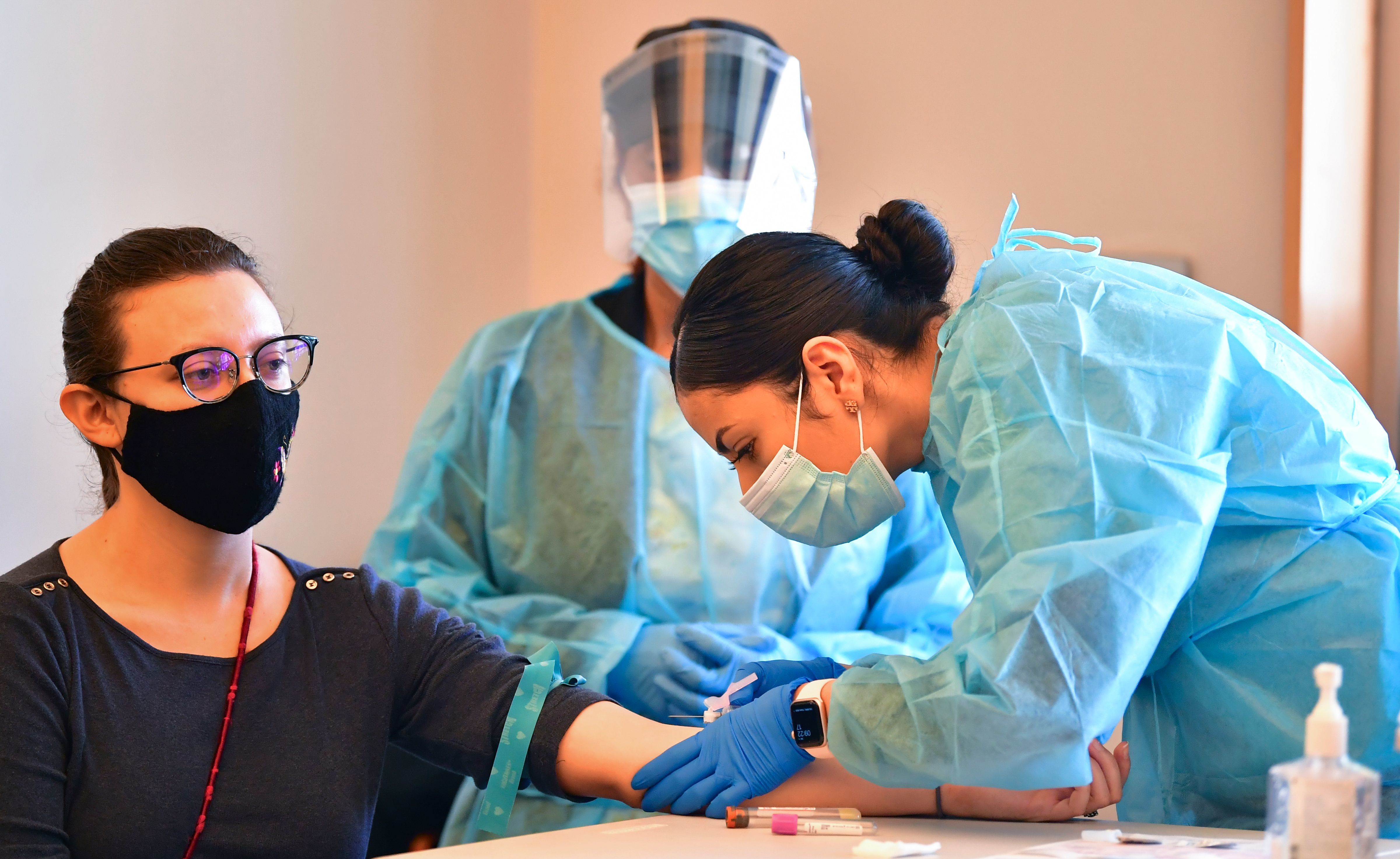 A phlebotomist draws blood at a free COVID-19 antibody testing event on Feb.17 in Pico Rivera, Calif. (AFP via Getty Images)