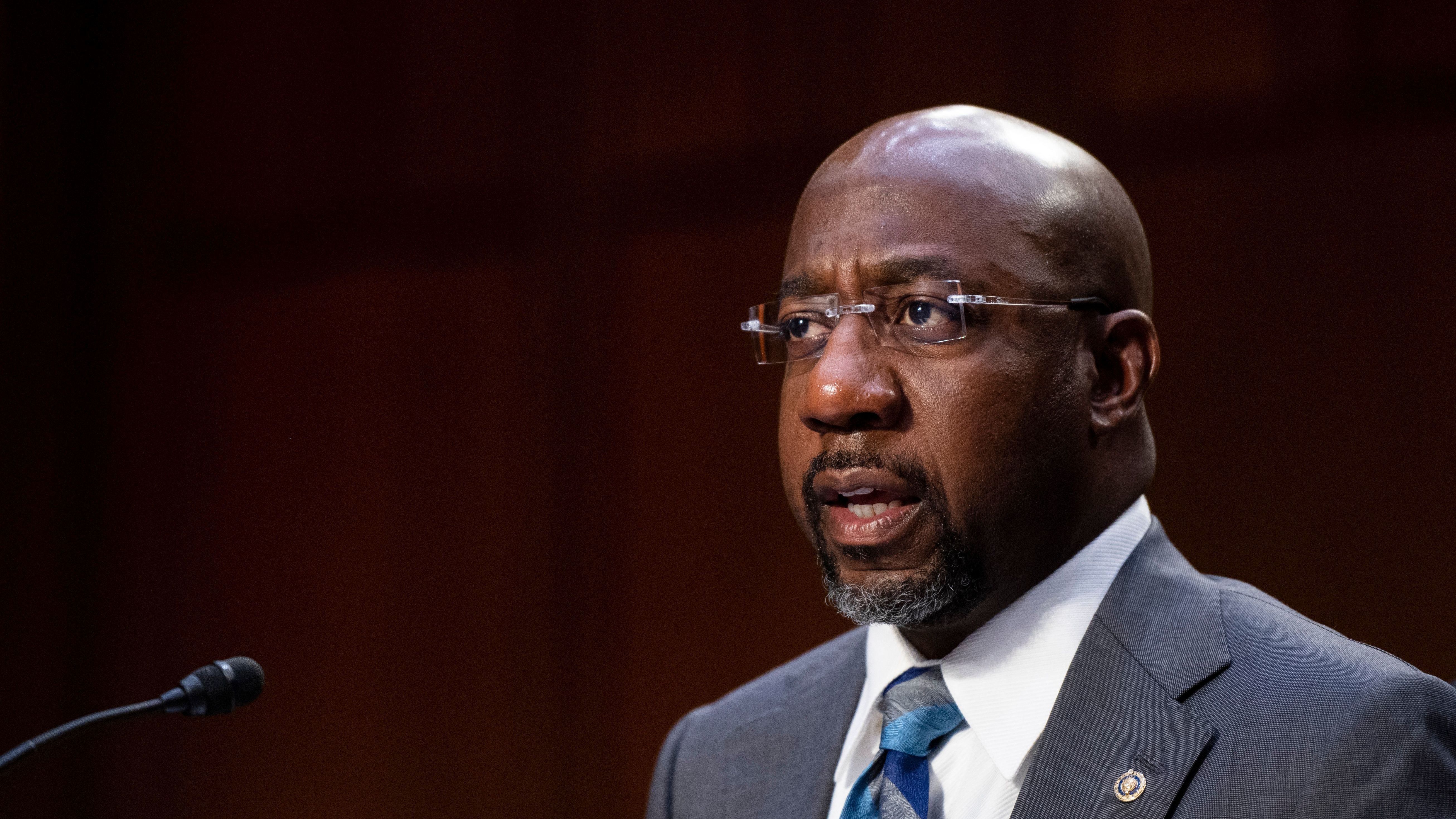 Sen. Raphael Warnock and his fellow Georgia Democrat, Jon Ossoff, are taking more progressive positions and sticking close to President Biden, while Arizona Democrats Mark Kelly and Kyrsten Sinema are opting for a more centrist approach. (Pool/AFP via Getty Images)