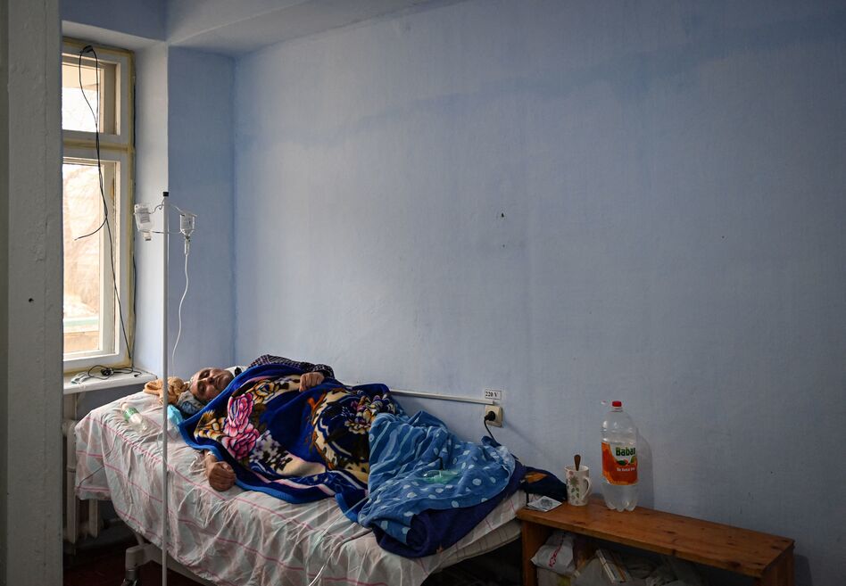 A patient rests at the COVID ward of the regional hospital in Leova, Moldova, on March 23. Moldova remains one of the poorest countries in Europe and has relied on vaccine donations from Romania and COVAX, a program that aims to distribute the world's vaccines more equitably. (Daniel Mihailescu /AFP via Getty Images)