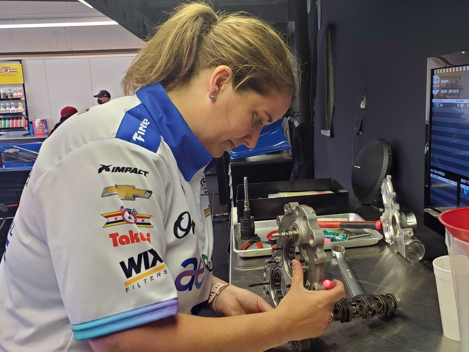 Mechanic Anna Chatten works on a spare gearbox for her team, Dreyer & Reinbold. 'If you would have asked me 20 years ago if I thought I would still be a solo wrench turner in the IndyCar paddock, I would have thought you were crazy,' she says.