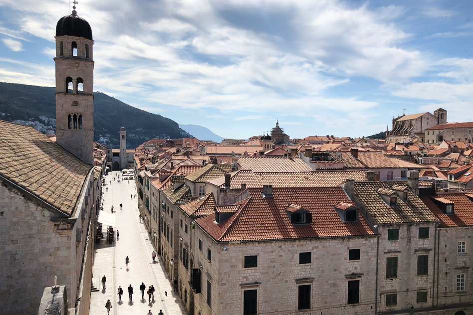 A view of Dubrovnik's old town from atop the ancient city wall. Few people are in the ancient town that's usually packed with tourists in the spring.