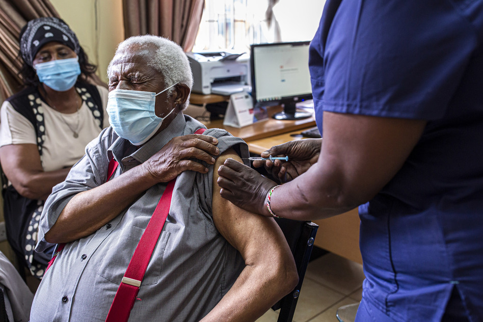 An older person receives their first dose of the AstraZeneca vaccine in Thika, Kenya. The vaccine's manufacturer, Serum Institute of India, announced this week that it will freeze all exports of the vaccine through the end of this year — leaving 20 million people in Africa without a source for their second dose.