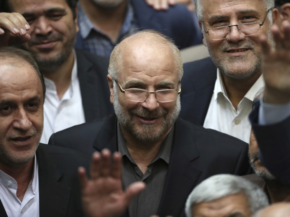 Mohammad Bagher Qalibaf (center) is surrounded by a group of lawmakers in Tehran after being elected speaker of the Iranian parliament on May 28, 2020. Qalibaf says international inspectors may no longer access images of the Islamic Republic's nuclear sites.