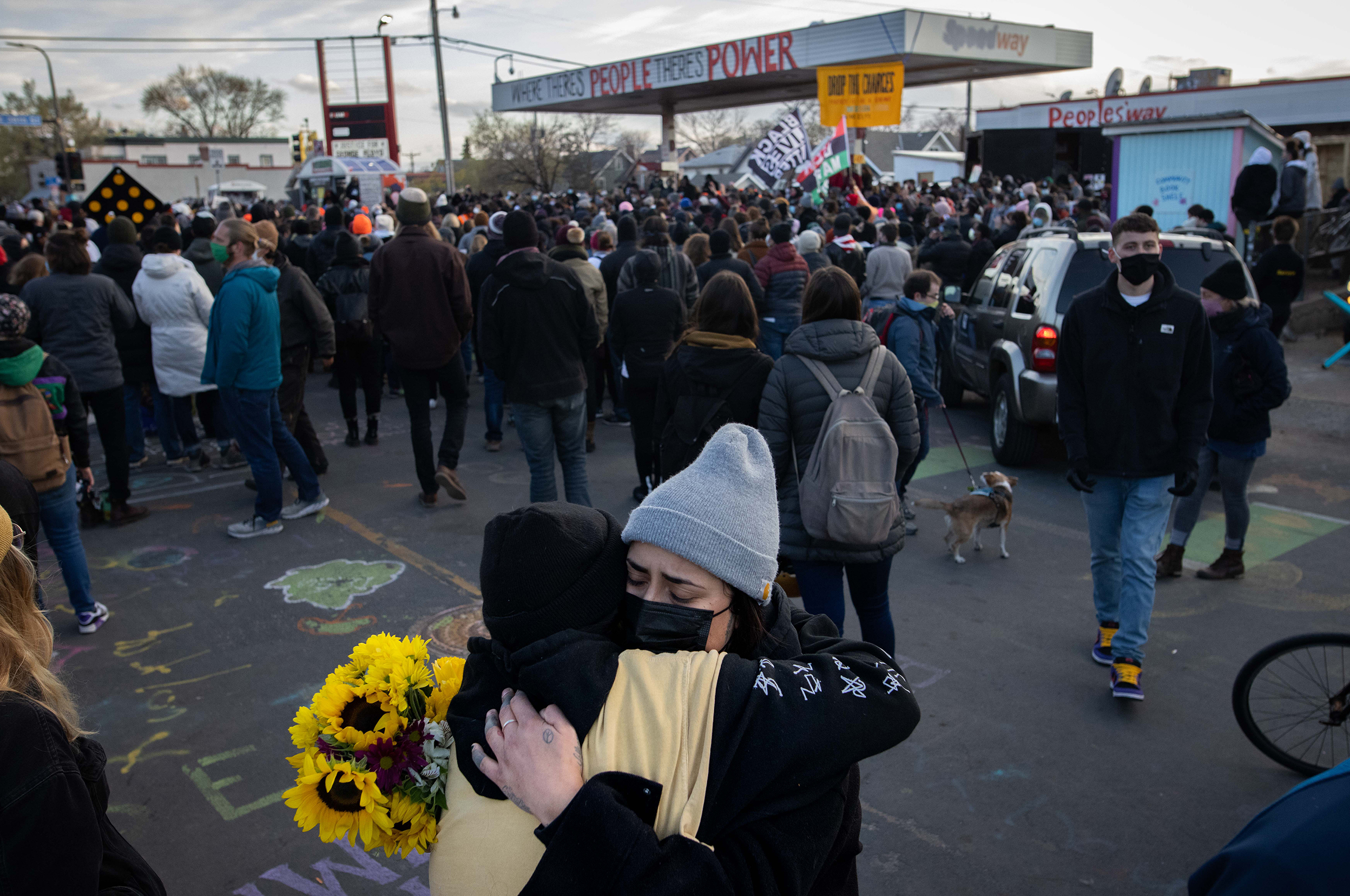 People embrace last month in Minneapolis after the verdict is announced in the trial of former Minneapolis police officer Derek Chauvin in the killing of George Floyd. (Bloomberg via Getty Images)