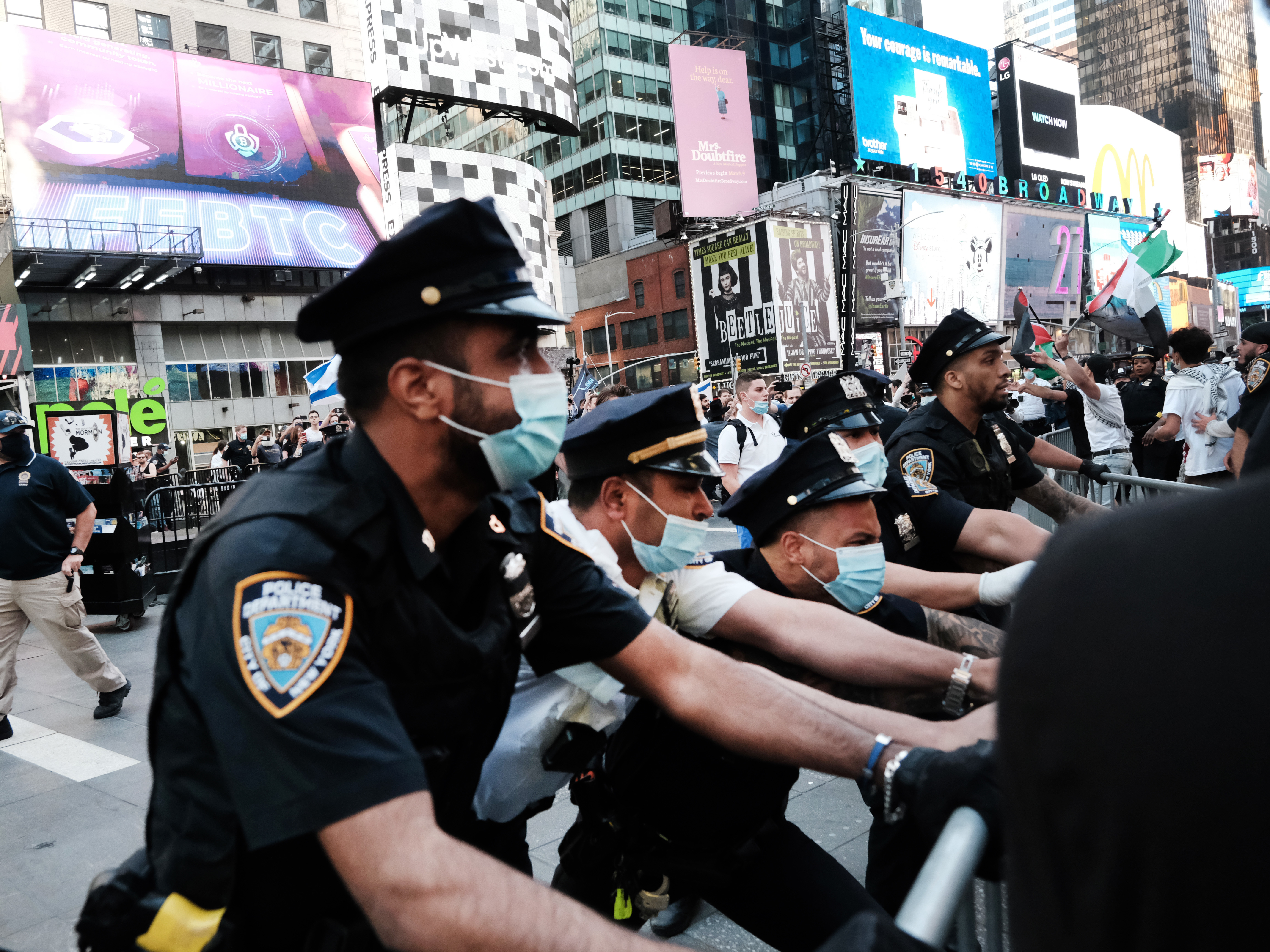 Pro-Palestinian protesters face off with Israel supporters and police last week in Times Square in New York City. (Getty Images)