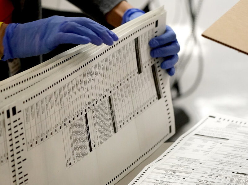 Maricopa County, Ariz., elections officials count ballots on Nov. 4 in Phoenix.