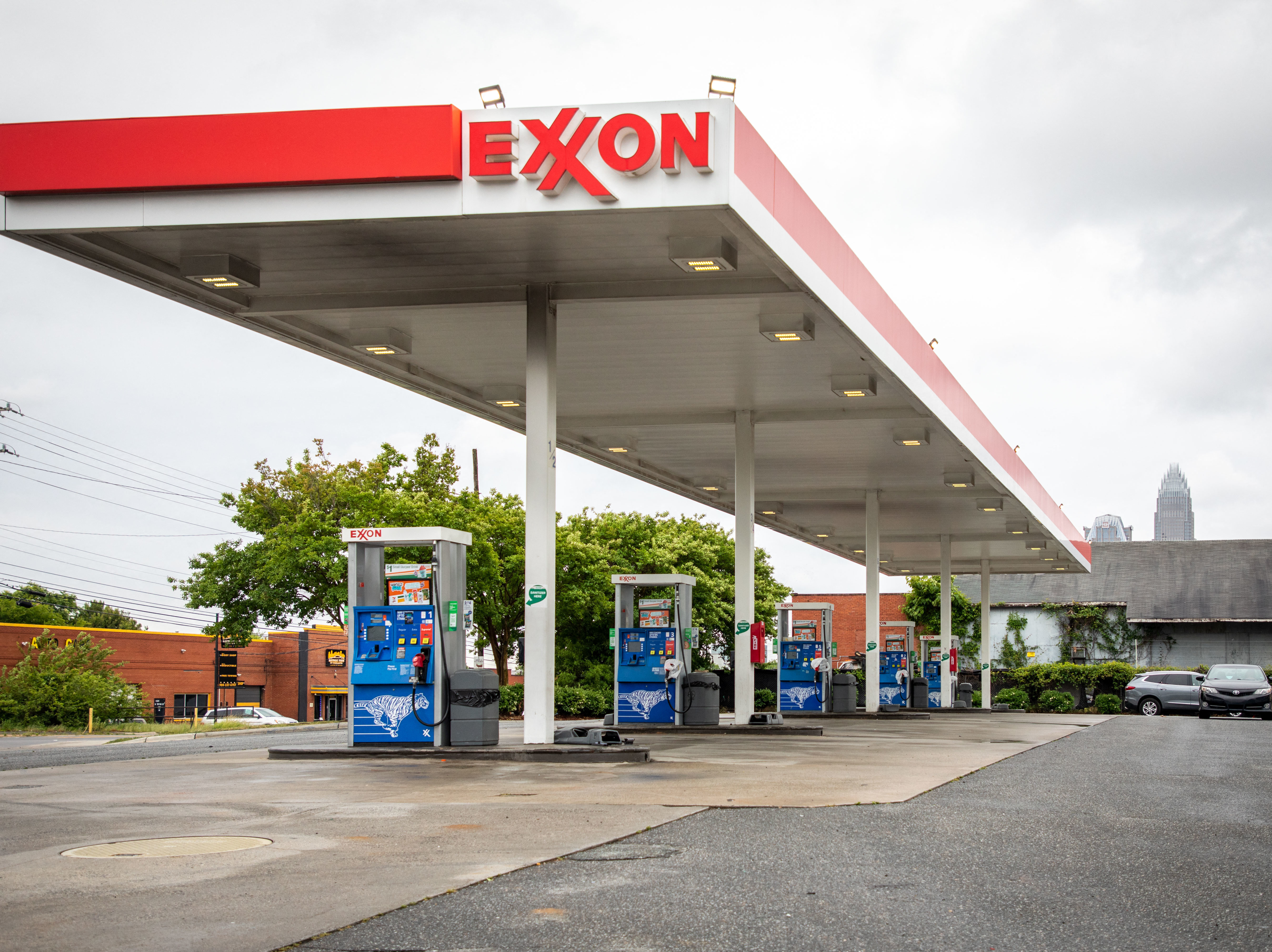 Pictured are pumps at an Exxon gas station in Charlotte, N.C. A tiny fund got two board members elected to the oil giant's board, delivering a historic defeat to ExxonMobil. (AFP via Getty Images)