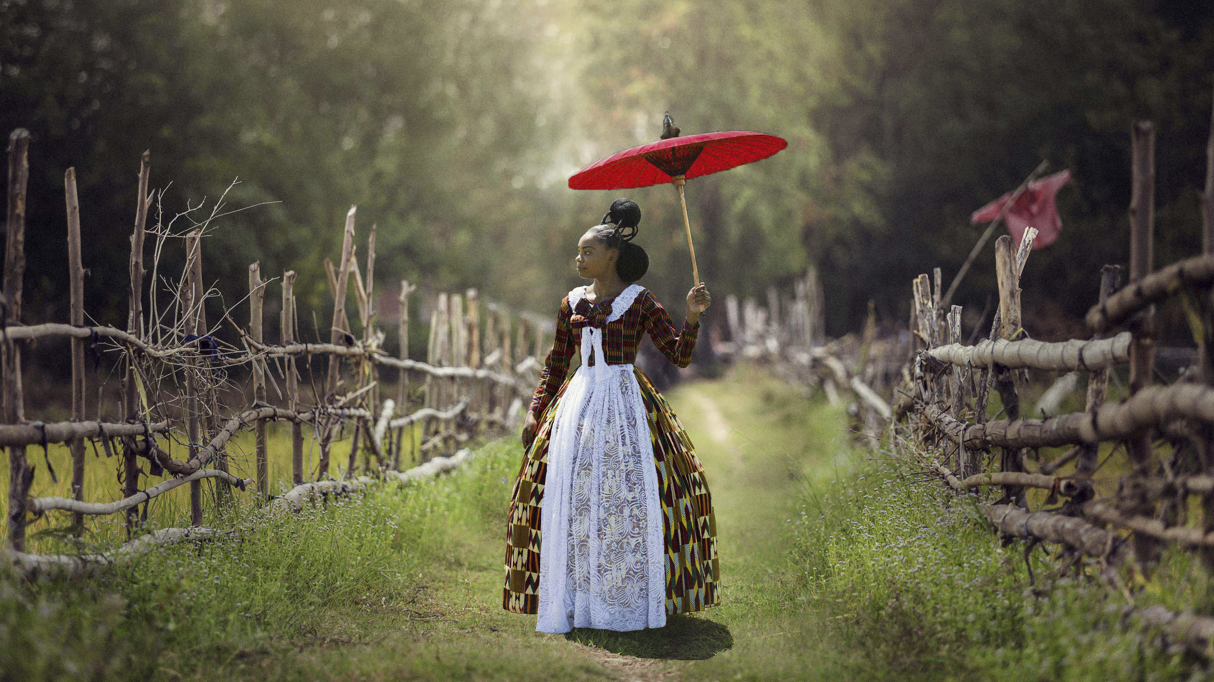 In Voyages of an African Victorian, a woman wears a Victorian-style dress made of African fabrics.