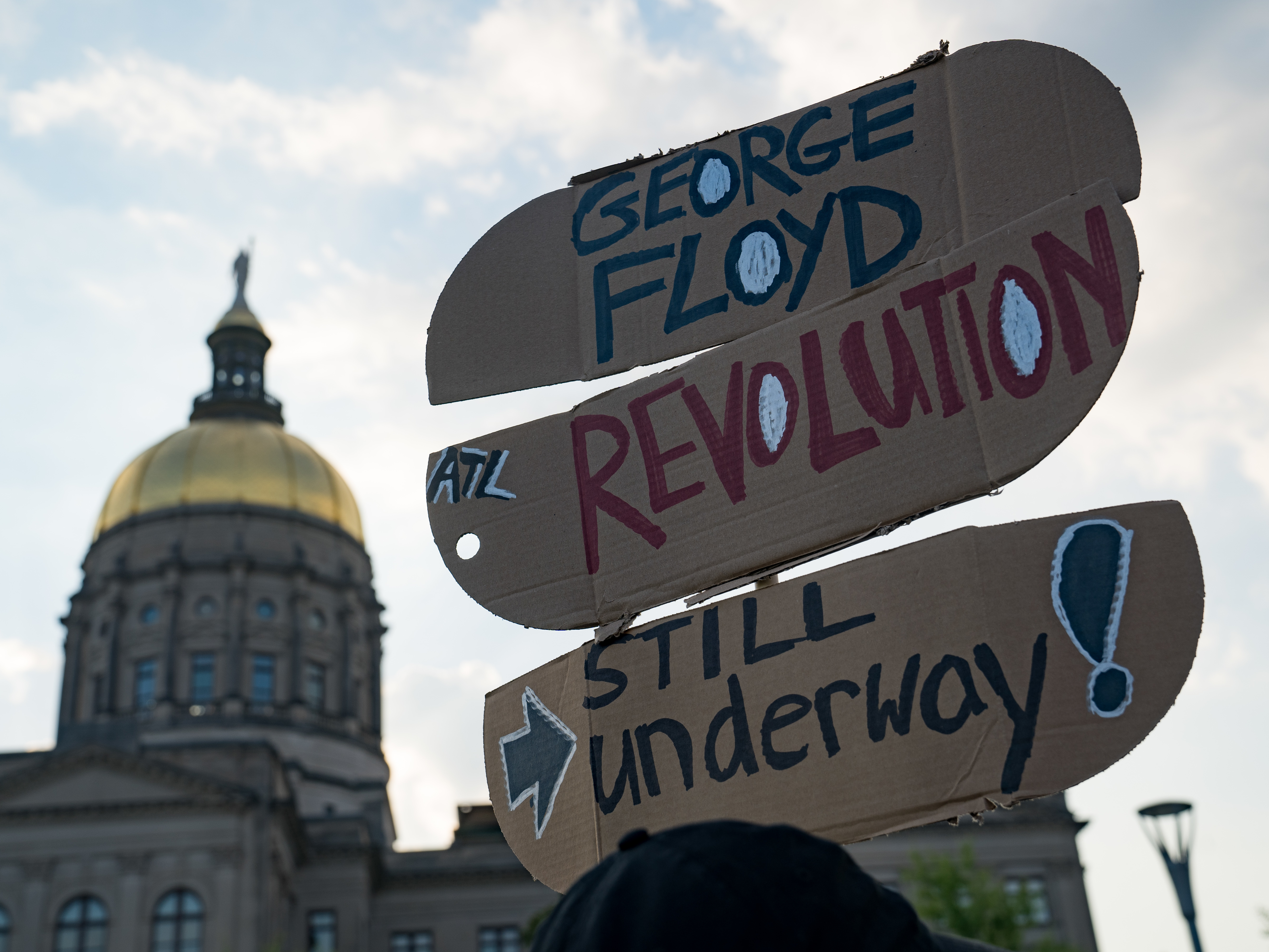 People gather to memorialize the life of George Floyd on the first anniversary of his death on Tuesday in Atlanta. America's corporations pledged to boost diversity soon after his death last year, but progress can be slow. (Getty Images)