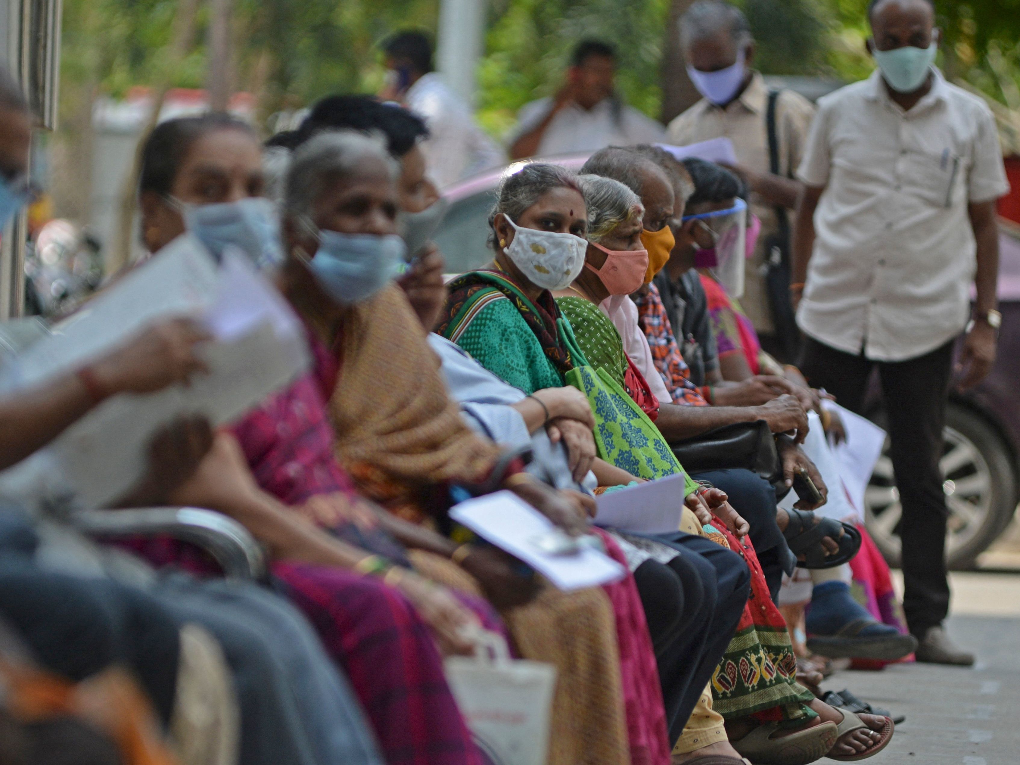 People wait their turn to receive the COVID-19 vaccine at a hospital in Chennai, India, in April. India is among the nations that will receive surplus U.S. vaccine through the international distribution system COVAX, the White House announced. (AFP via Getty Images)