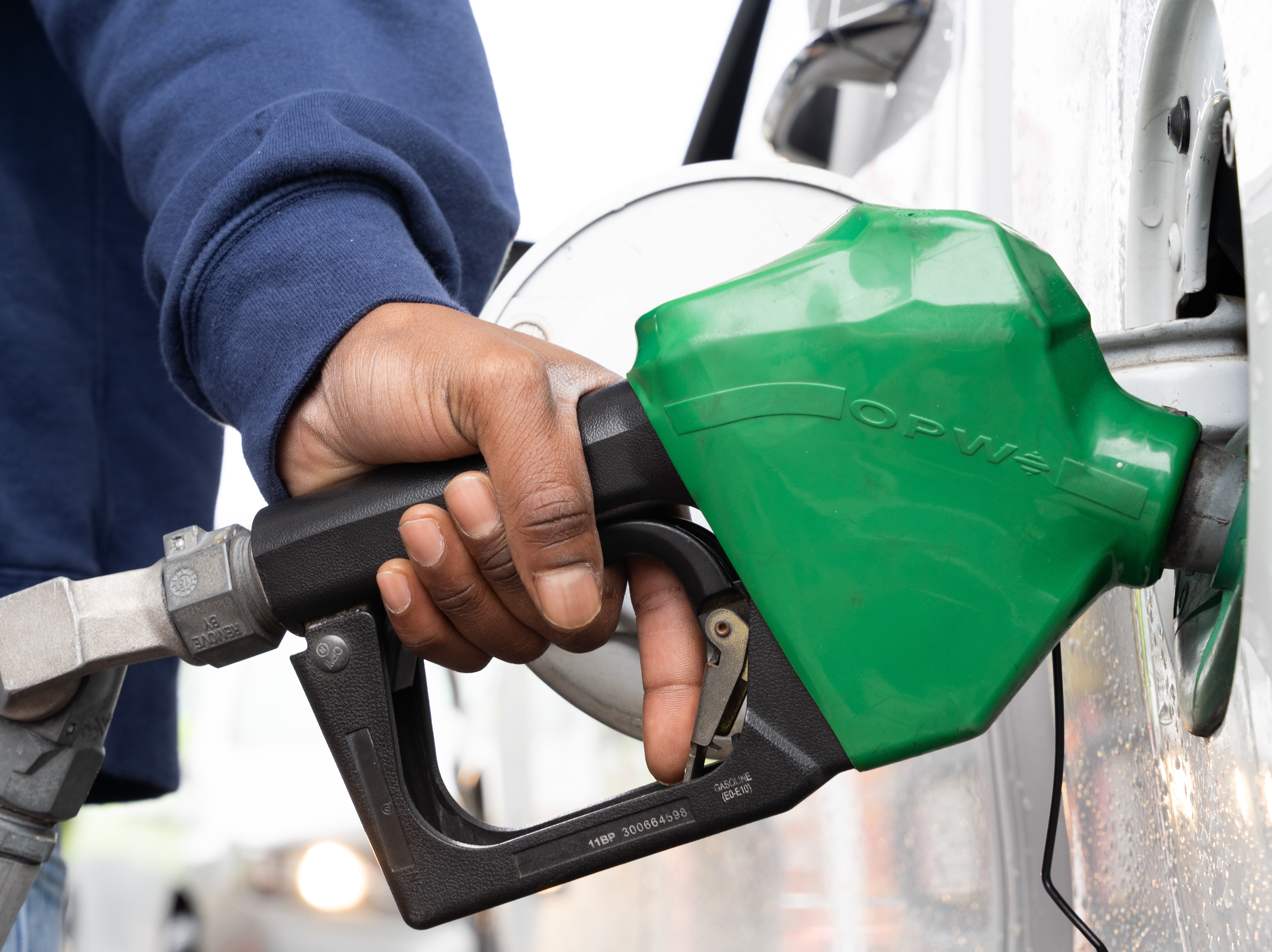 A man refuels at a gas station last month in Fayetteville, N.C., during a period when a hacking attack shut down a key pipeline. Oil companies confront an uncertain future, facing pressure to move toward greener energy. (Getty Images)