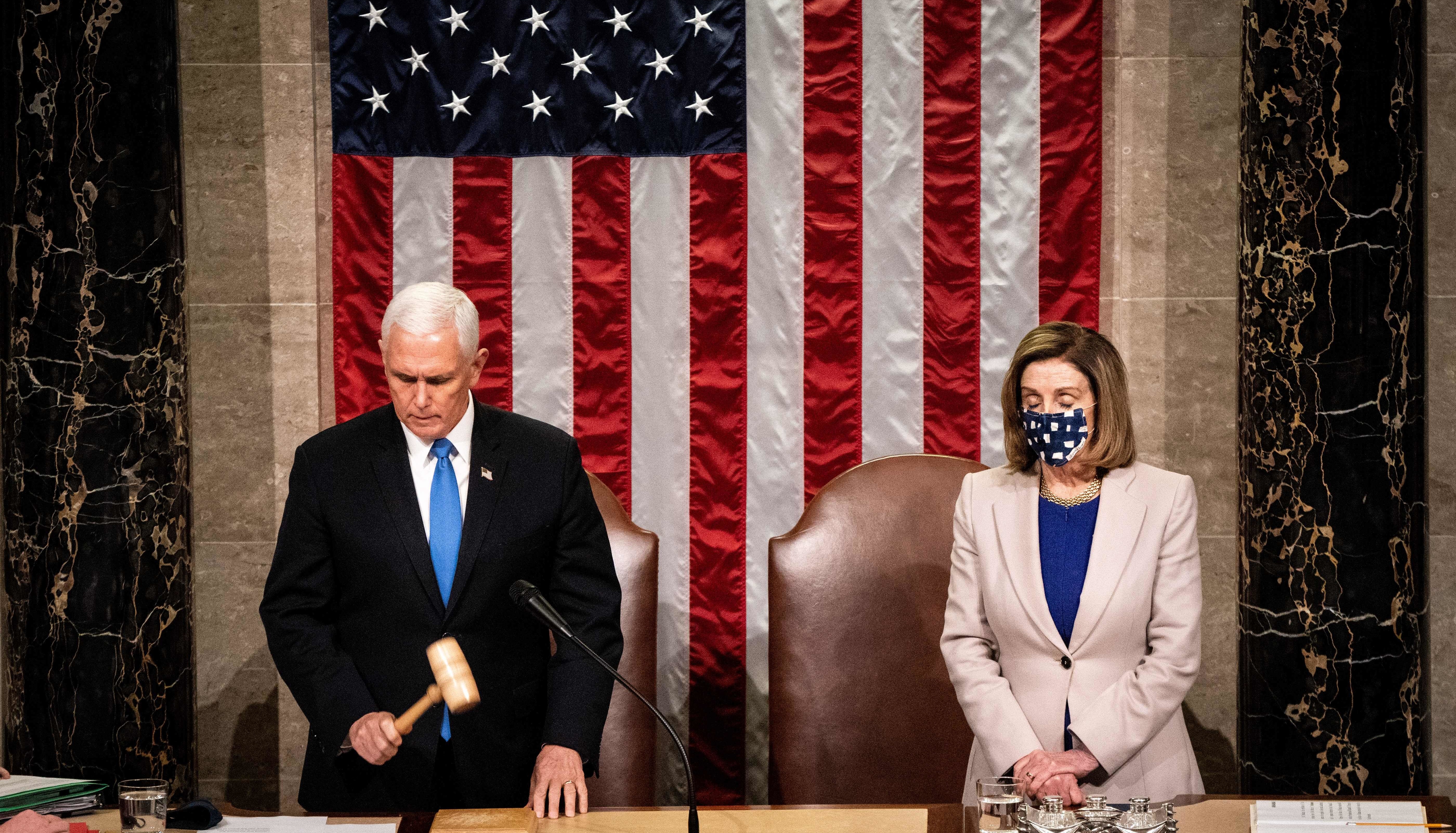 Then-Vice President Mike Pence and House Speaker Nancy Pelosi preside over a joint session of Congress on Jan. 6 to certify the 2020 Electoral College results after a pro-Trump mob stormed the Capitol earlier that day. (Pool/AFP via Getty Images)