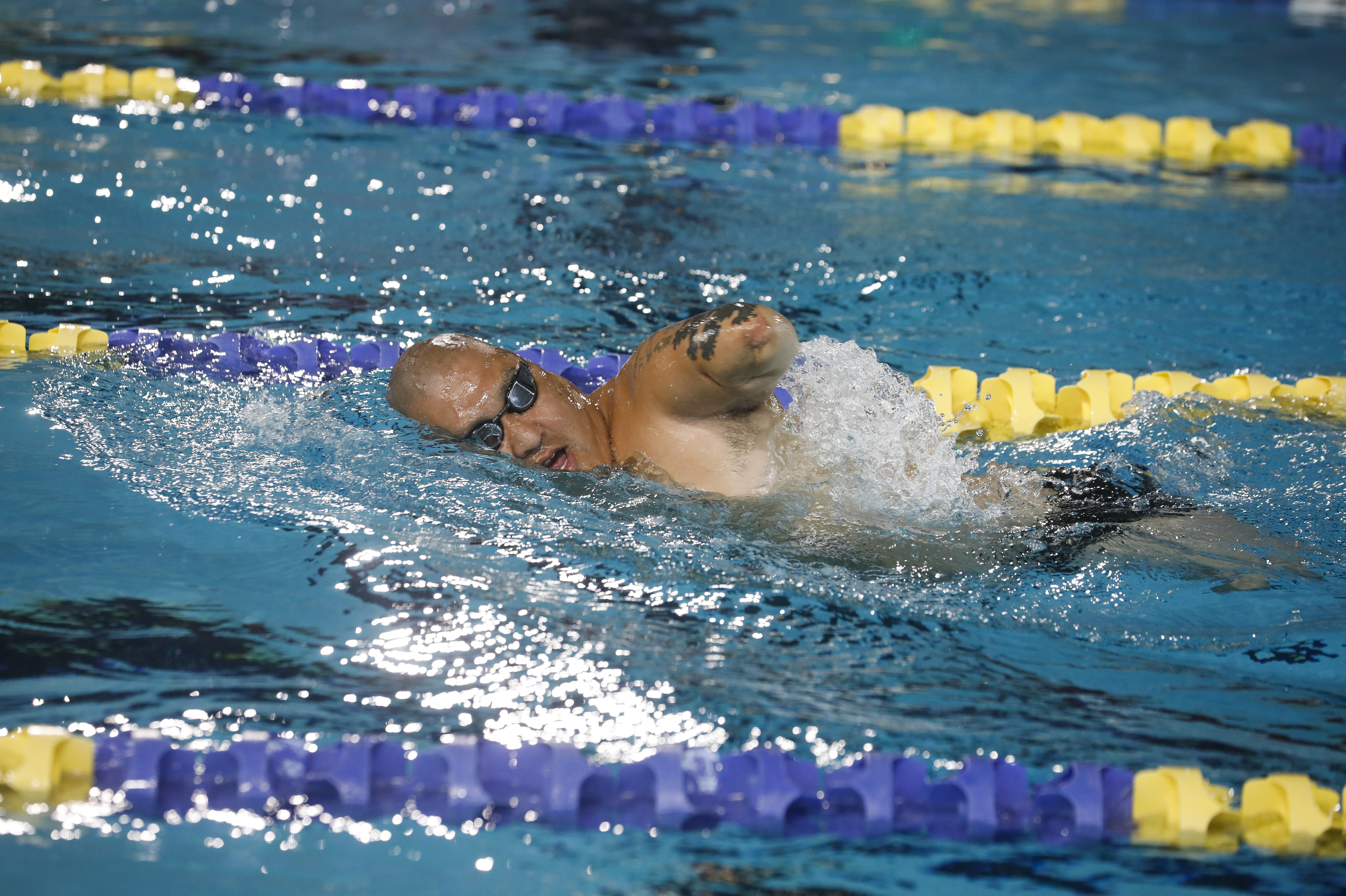 What Happens When A Nation Goes To War, And A Small Few Bear The Costs 2 Lammers swims during the 2019 Department of Defense Warrior Games in Clearwater, Fla.