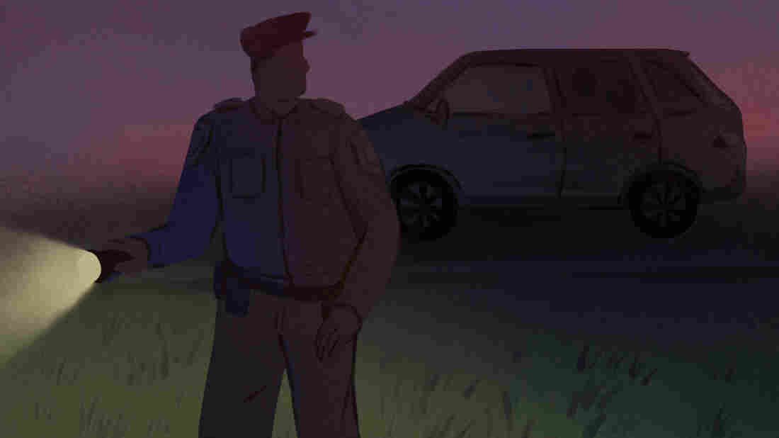 A police officer walks away from a dark car with two figures in the back seat