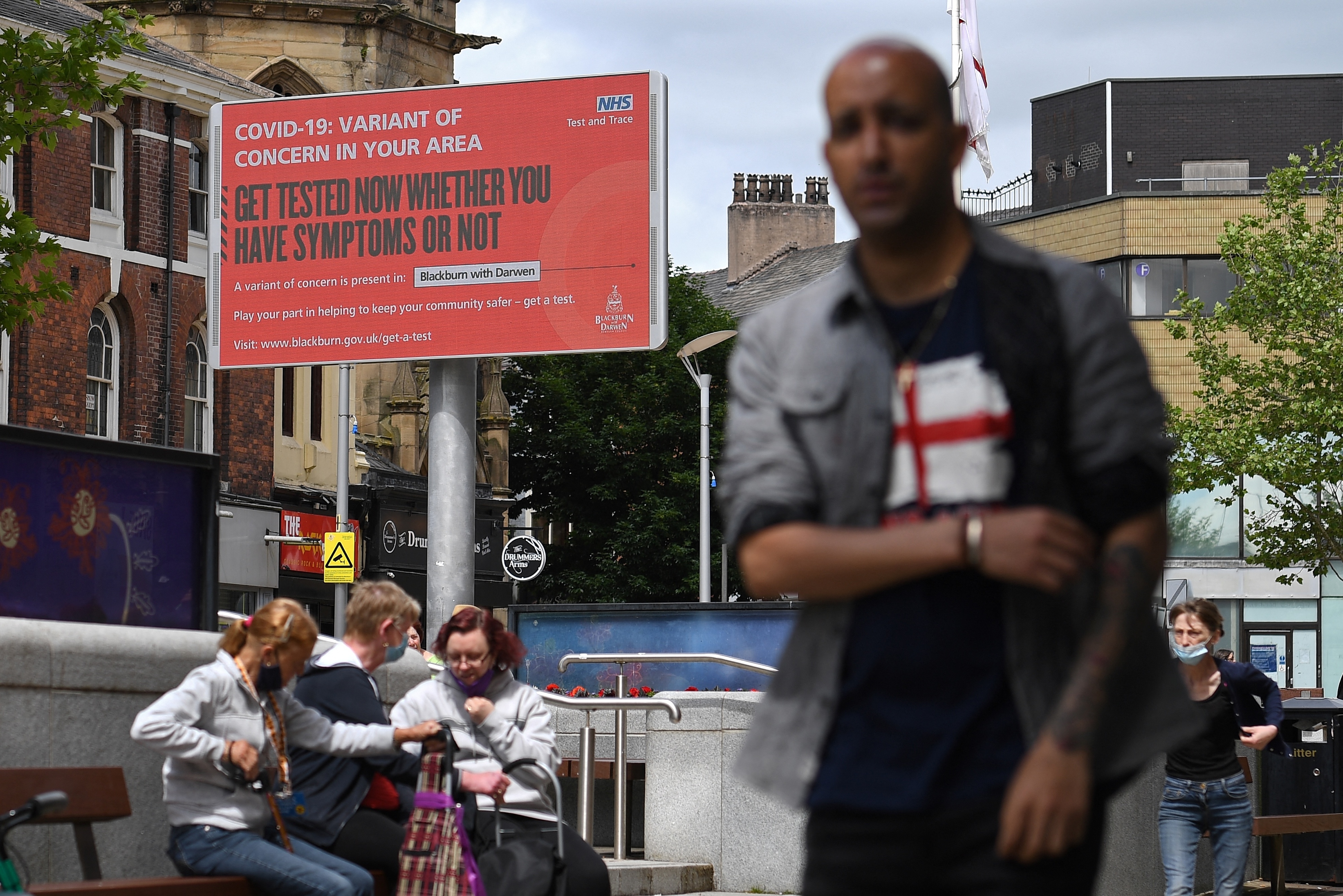 A sign urges people to get tested for a COVID-19 variant in Blackburn, England. The U.K. is experiencing a surge in the delta variant, which was first identified in India. (AFP via Getty Images)