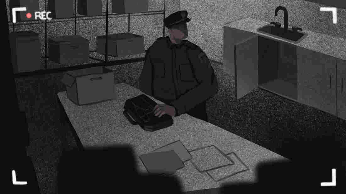 A man is seen through a surveillance camera, moving a toolkit containing a drill.
