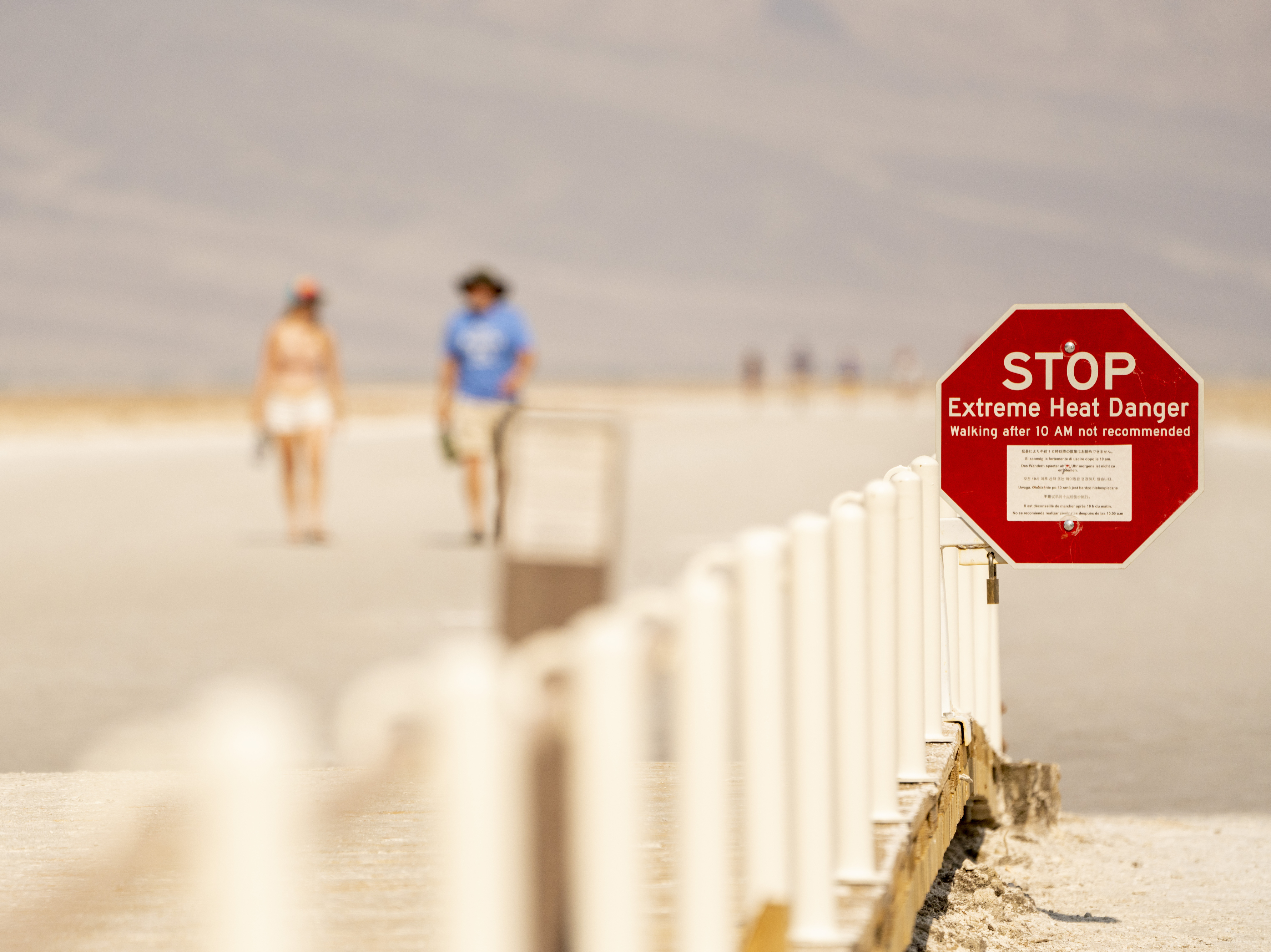 A sign warns of extreme heat danger last June at the Badwater Basin in Death Valley, Calif. (Bloomberg via Getty Images)