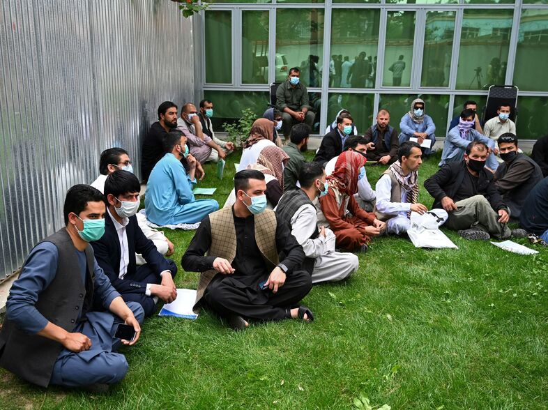 Former interpreters for U.S. and NATO forces gather during a demonstration in downtown Kabul, Afghanistan, on April 30, on the eve of the beginning of Washington's troop withdrawal. (Wakil Kohsar/AFP via Getty Images)