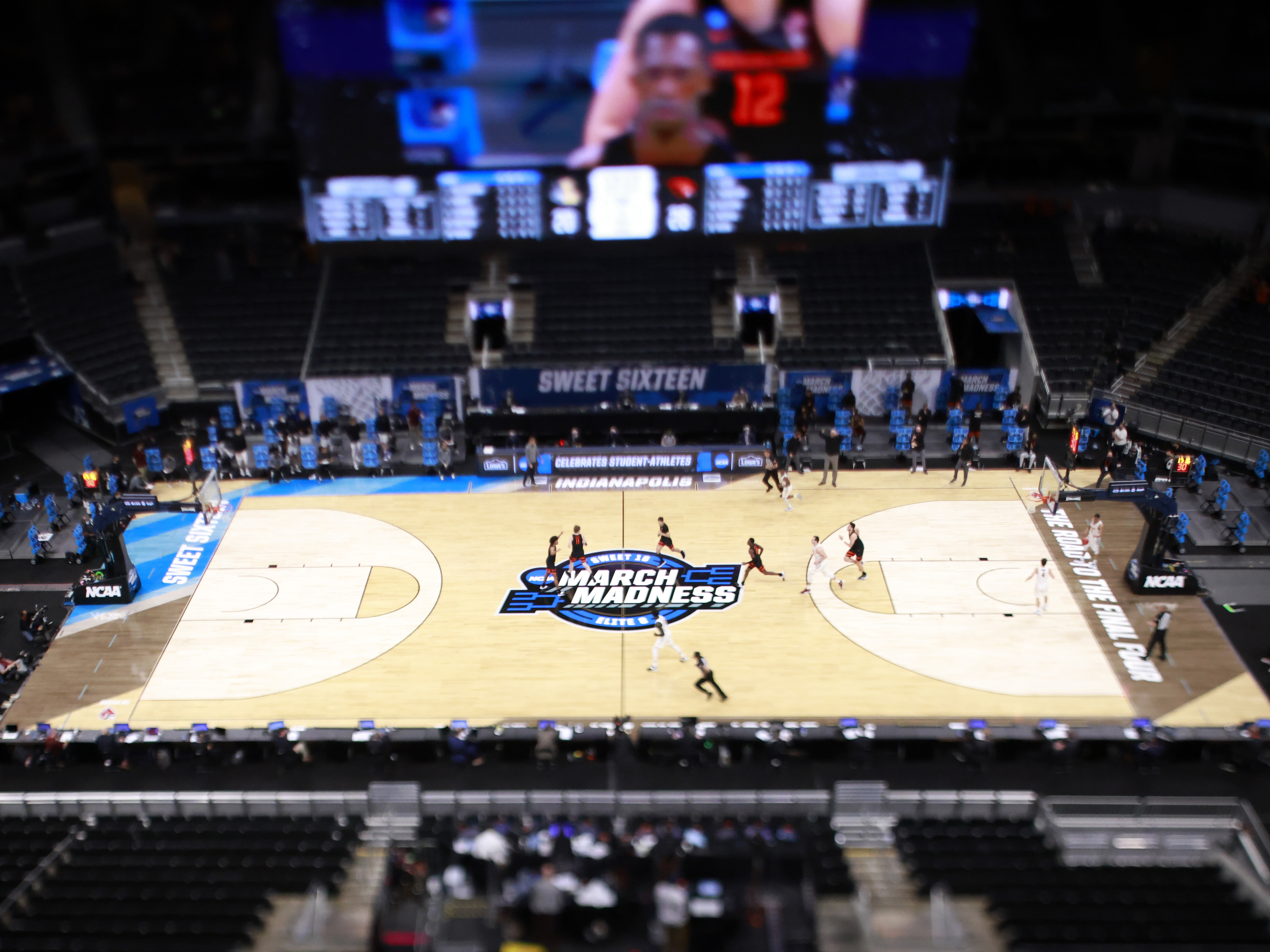 The March Madness logo on the court during the Sweet Sixteen round of the 2021 NCAA Men's Basketball Tournament in Indianapolis. Soon, some college athletes can get money when using their name, image or likeness. (Getty Images)