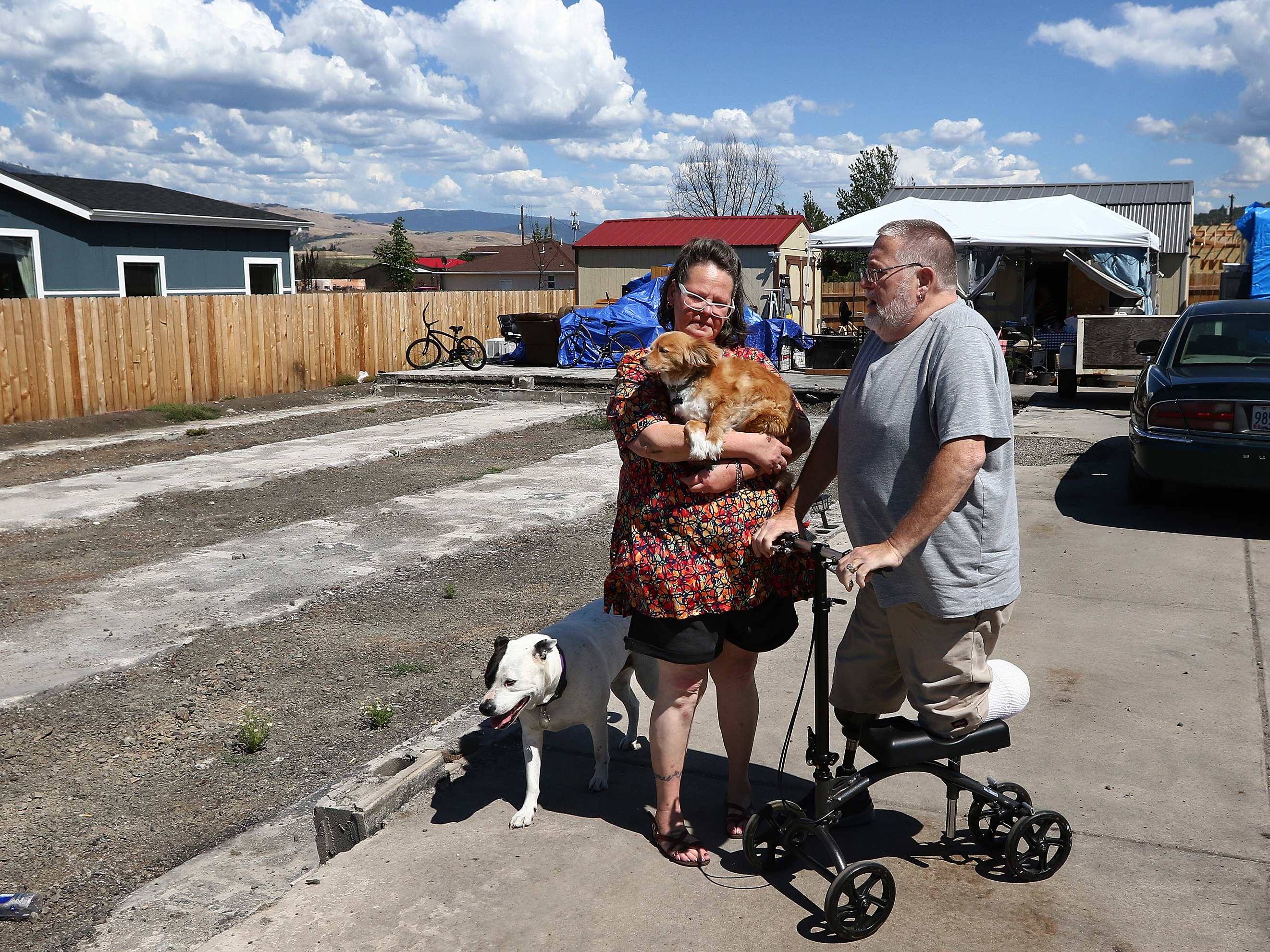 As Western Wildfires Worsen, FEMA Is Denying Most People Who Ask For Help 6 Robin Parker and her husband, Jim Parker, stand next to where their home previously stood in Talent, Ore. The home was destroyed by wildfire in 2020.