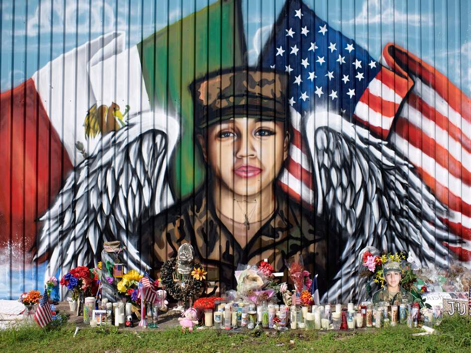 Candles and flowers decorate a makeshift memorial for Vanessa Guillén, a Fort Hood, Texas, soldier whose 2020 killing put a spotlight on sexual harassment in the U.S. military. (Mark Felix/AFP via Getty Images)