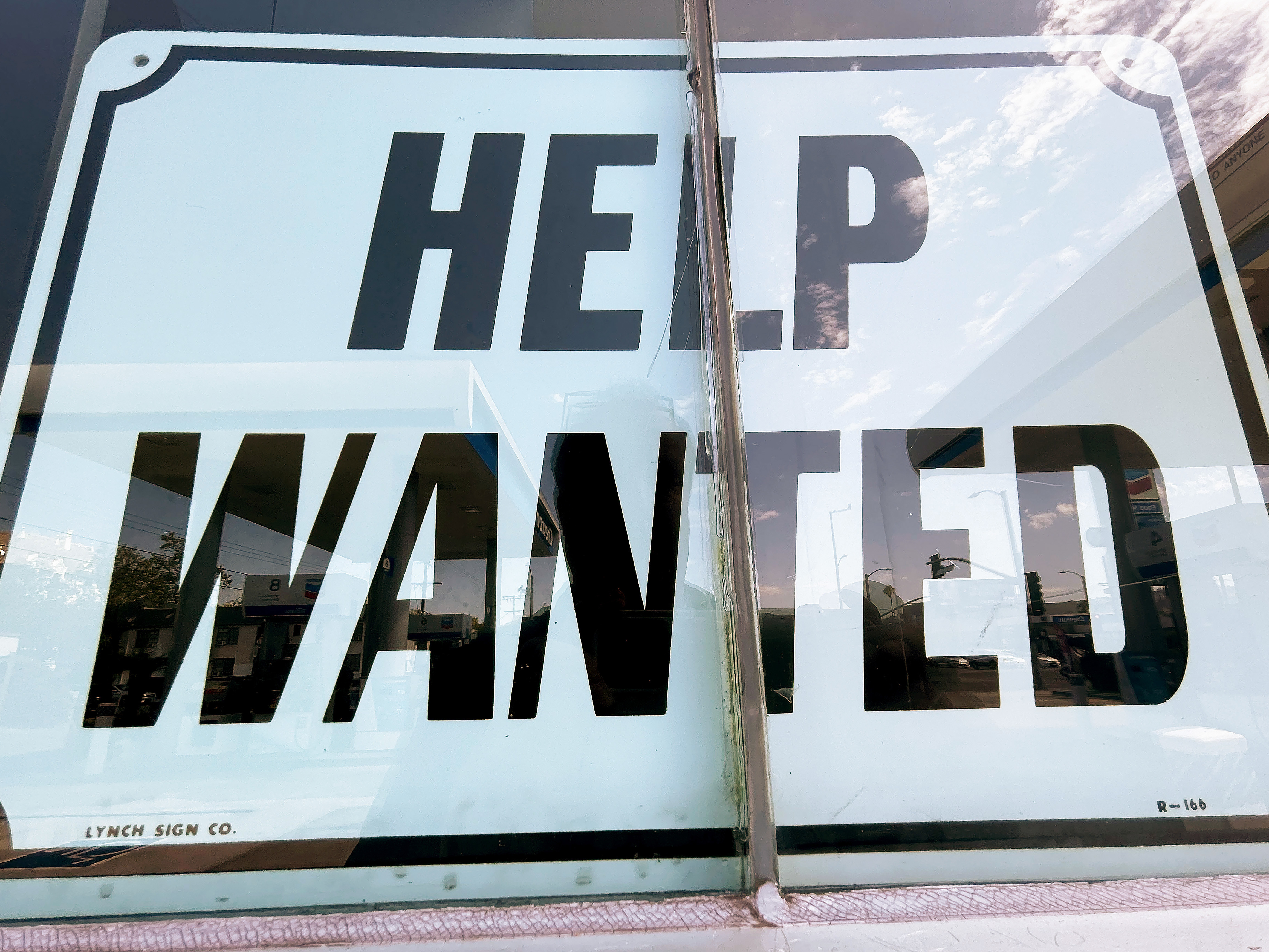 A &quot;Help Wanted&quot; sign is displayed at a gas station in Los Angeles. After surviving the pandemic, small businesses across the country are struggling to find workers (Getty Images)