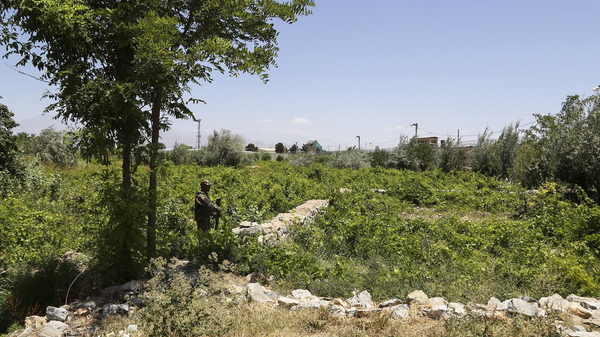 An Afghan Army soldier patrols outside Bagram Air Base on July 2.