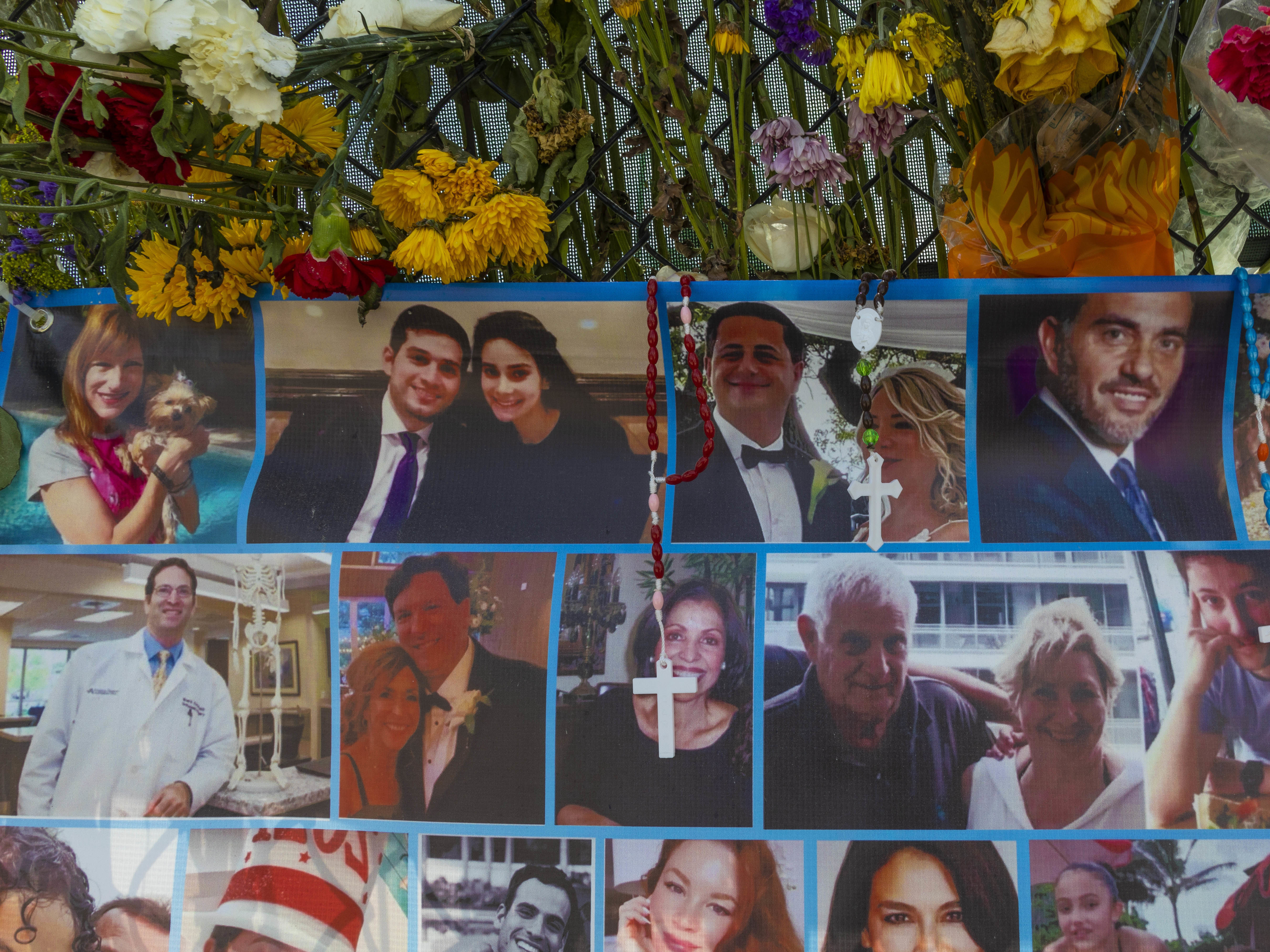 A memorial shows some of the people still missing from the Champlain Towers South condo collapse in Surfside, Fla. (Getty Images)