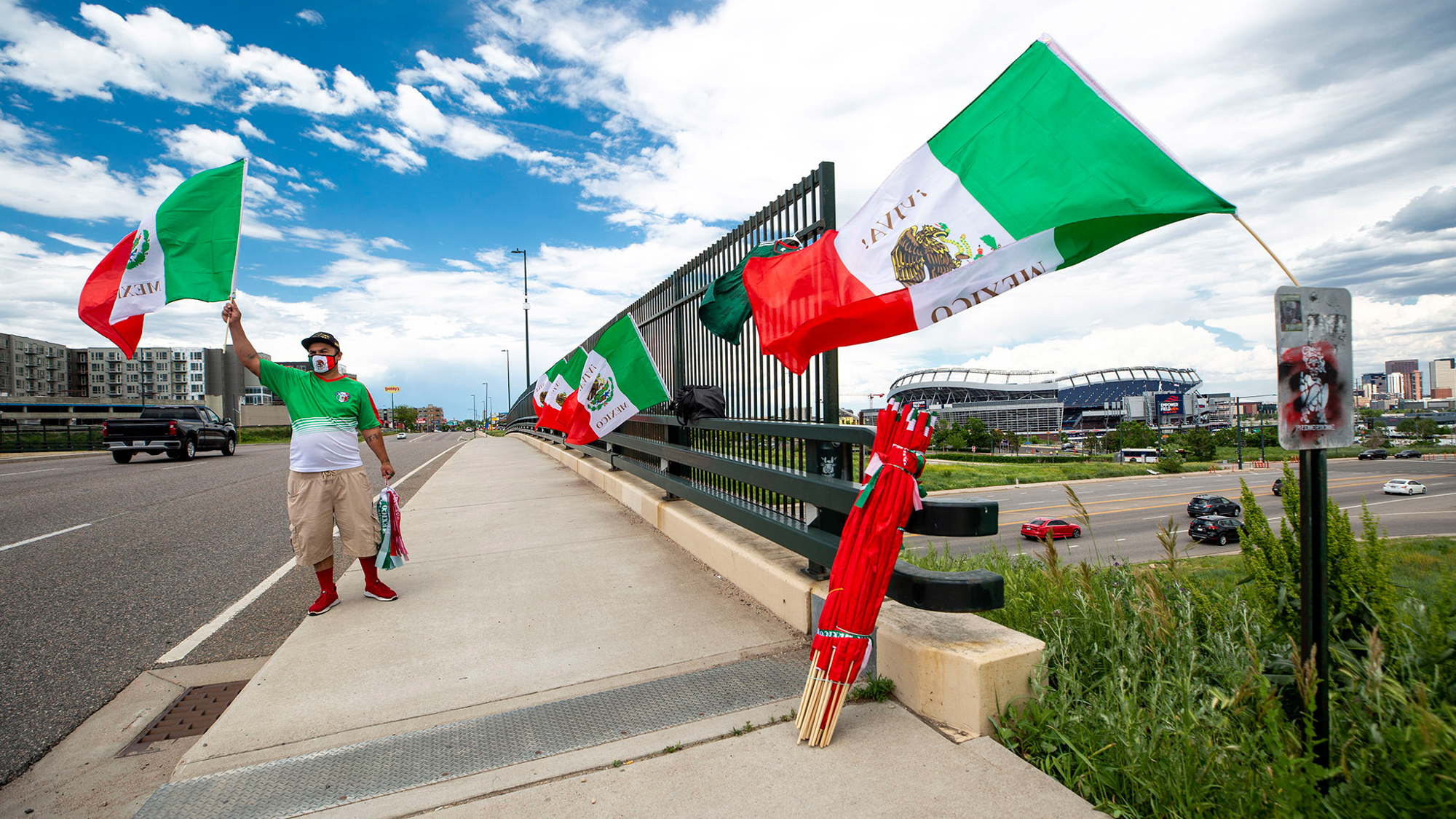 Raul Gomez sells Mexican flags Tuesday before the U.S. and Mexico national teams face off in the CONCACAF Nations League finals at Mile High Stadium.