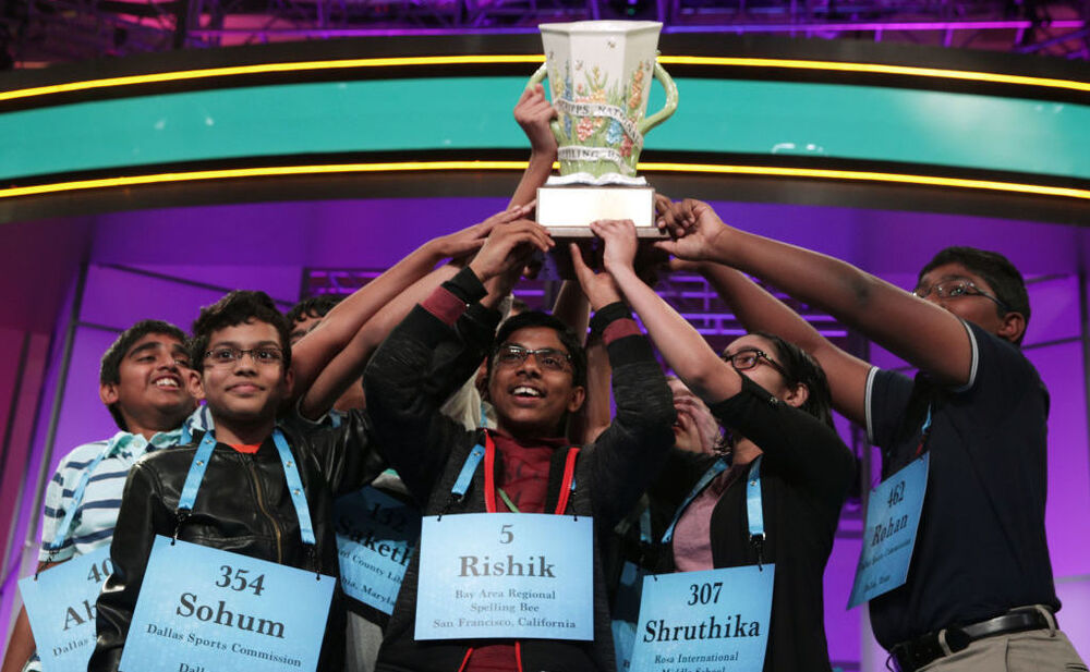 The 2019 Scripps Spelling Bee co-champions hold up their trophy at the Gaylord National Resort & Convention Center in National Harbor, Md. After pausing in 2020, the competition is back on this year. The finals are Thursday night in Orlando, Fla. (Getty Images)