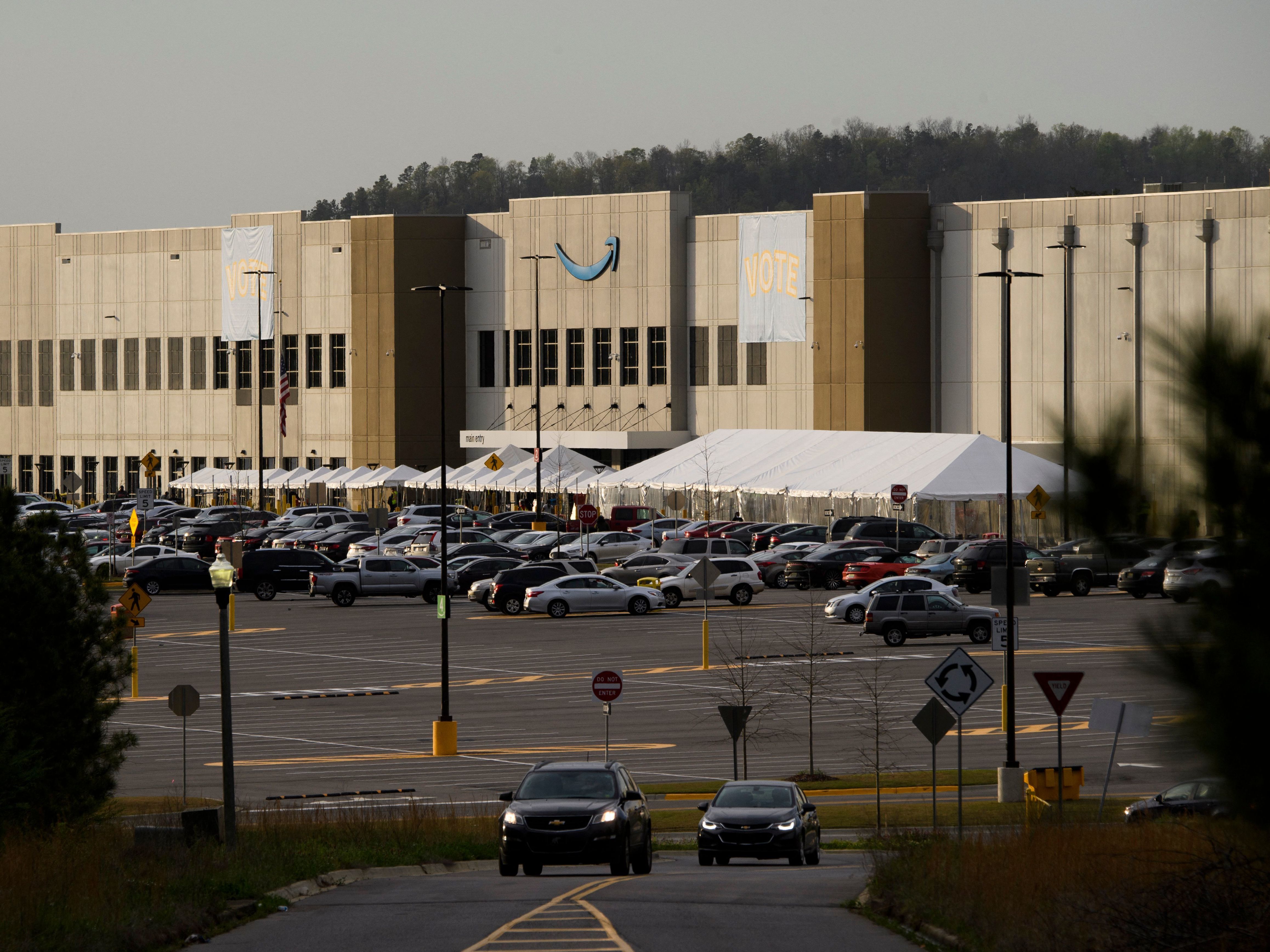 Signs reading &quot;vote&quot; hang outside the Amazon warehouse in Bessemer, Ala., in March as workers wrapped up their seven-week mail-in election on whether to unionize. (AFP/Getty Images)