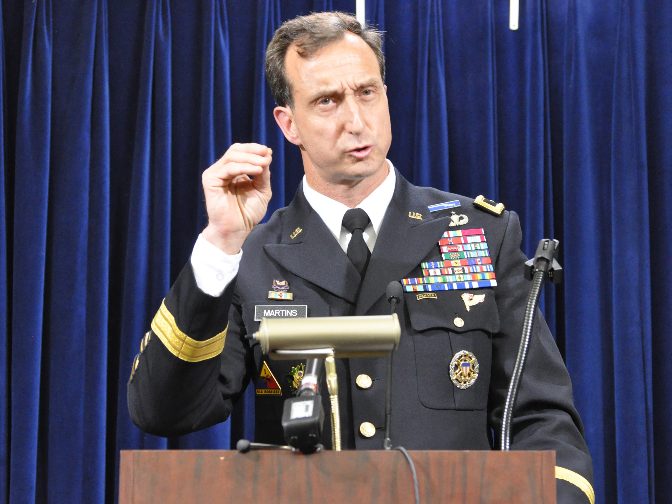 Army Brig. Gen. Mark Martins, Guantánamo's chief prosecutor, addresses the media on Oct. 19, 2012, at the end of a week of pretrial hearings for the five alleged architects of the 9/11 attacks. Martins announced his retirement this week. (Toronto Star via Getty Images)