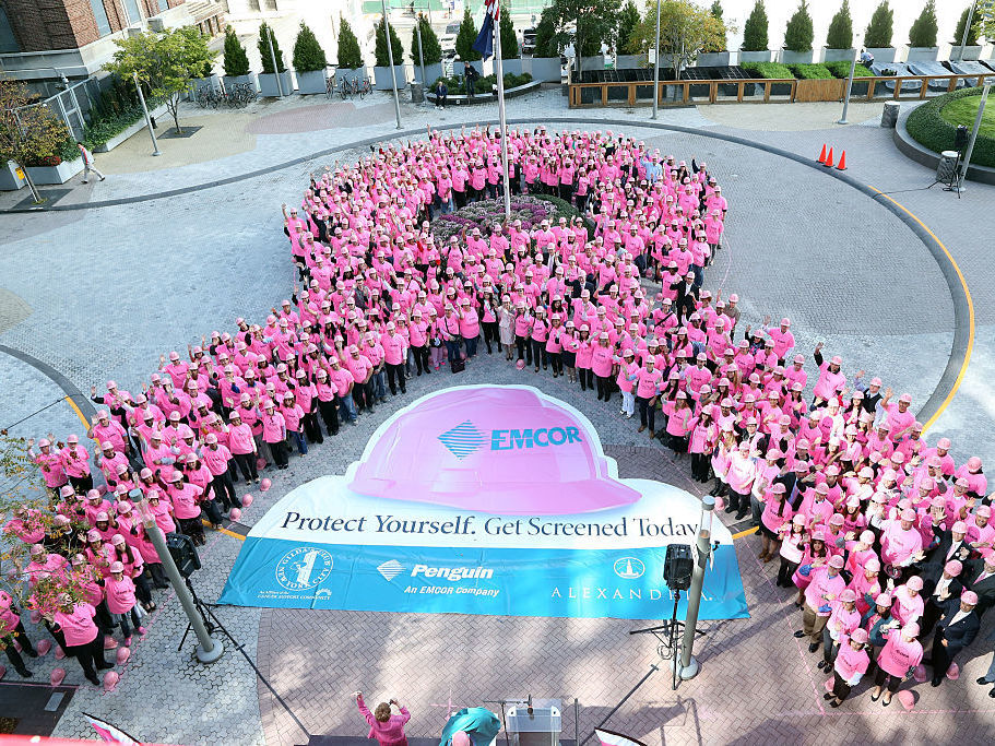 A human &quot;Pink Ribbon&quot; chain is made to raise breast cancer screening awareness in New York City. (Getty Images)