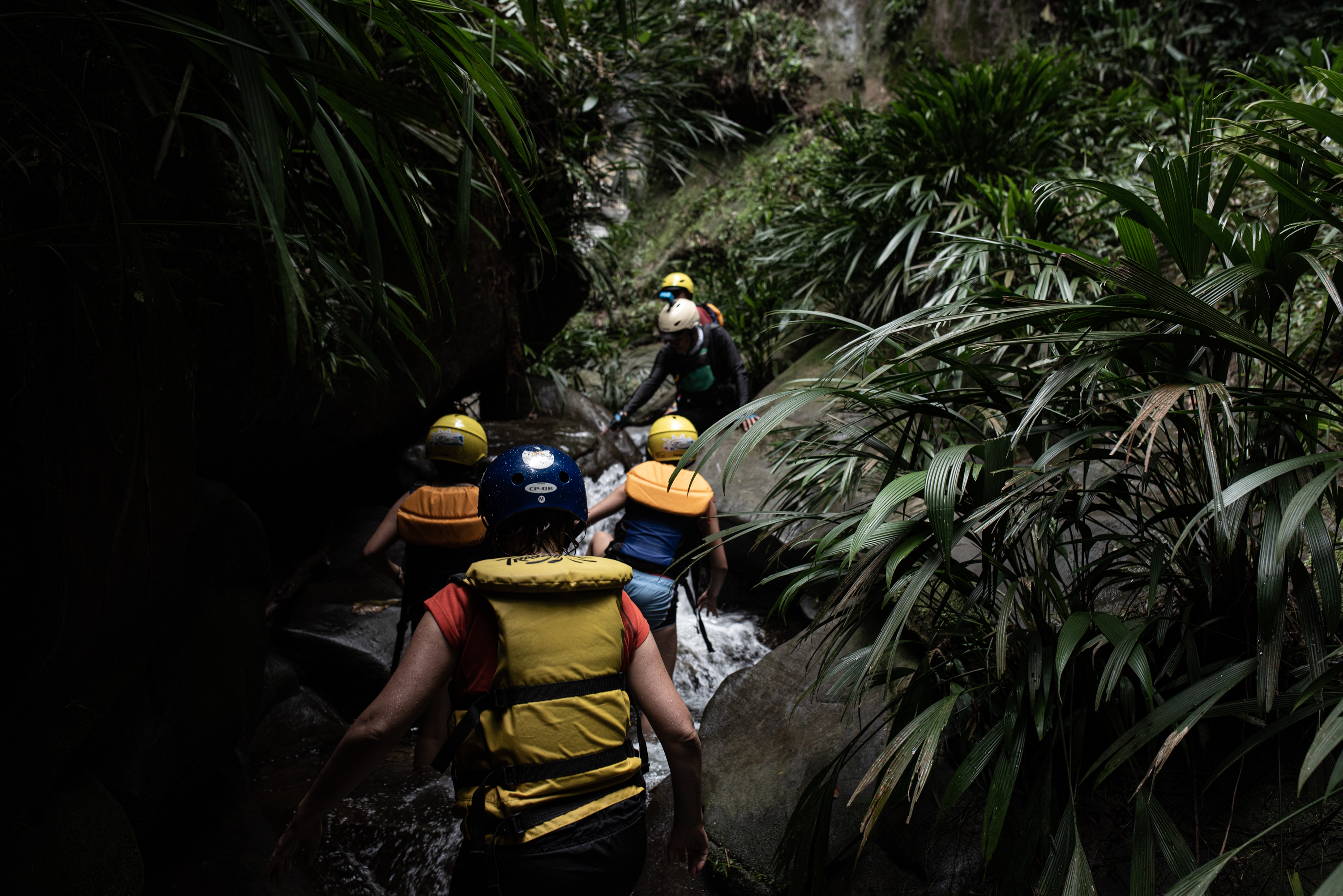 While rafting down the Guejar River, tourists stop to hike along a stream to a waterfall near the town of Mesetas, which used to be under FARC rebel control in southern Colombia. (Carlos Saavedra for NPR)
