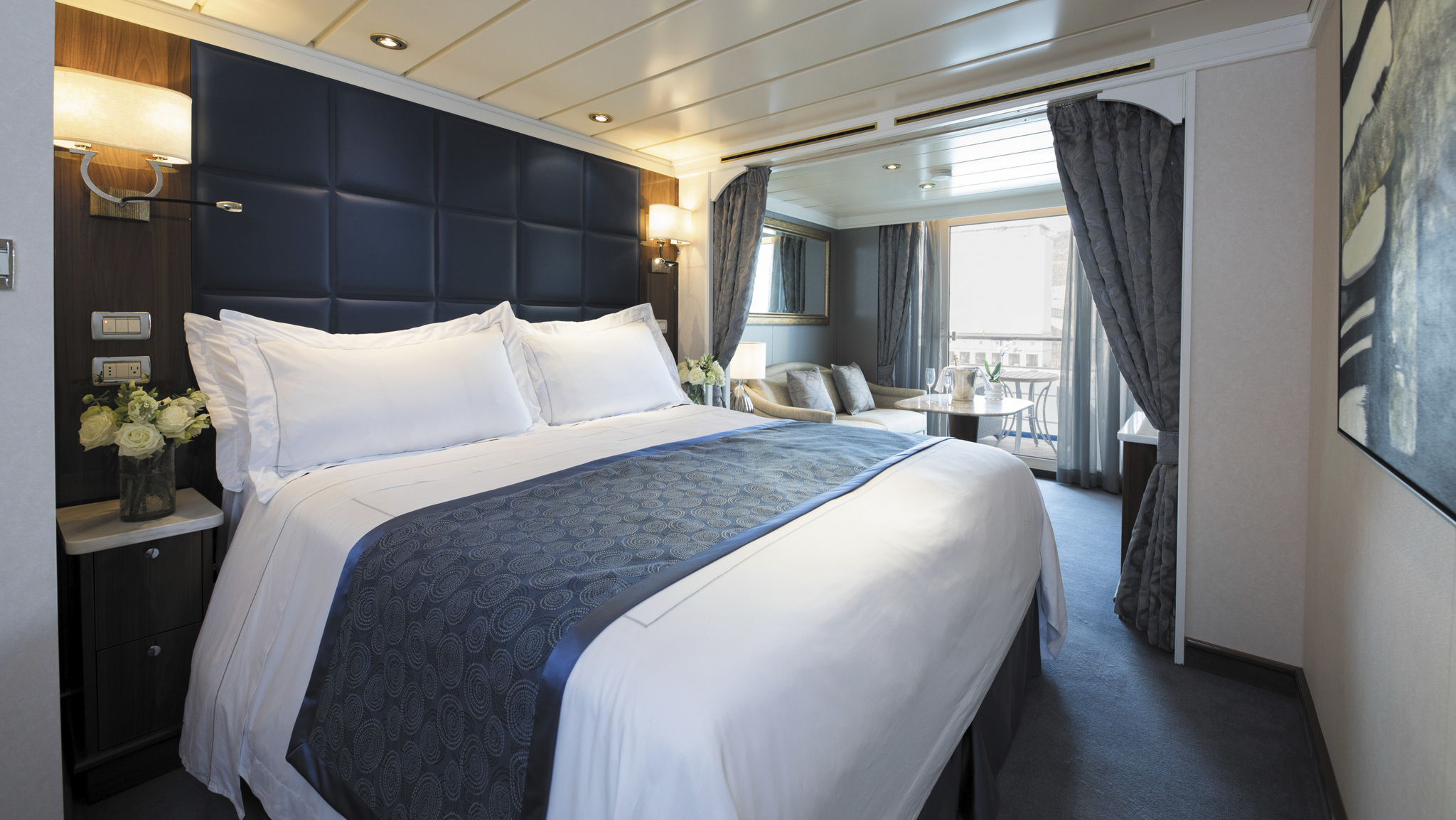 Home away from home: Passengers on the Seven Seas Mariner will sail around the world in a &quot;deluxe veranda suite&quot; — a voyage that will last more than four months. (Regent Seven Seas Cruises)