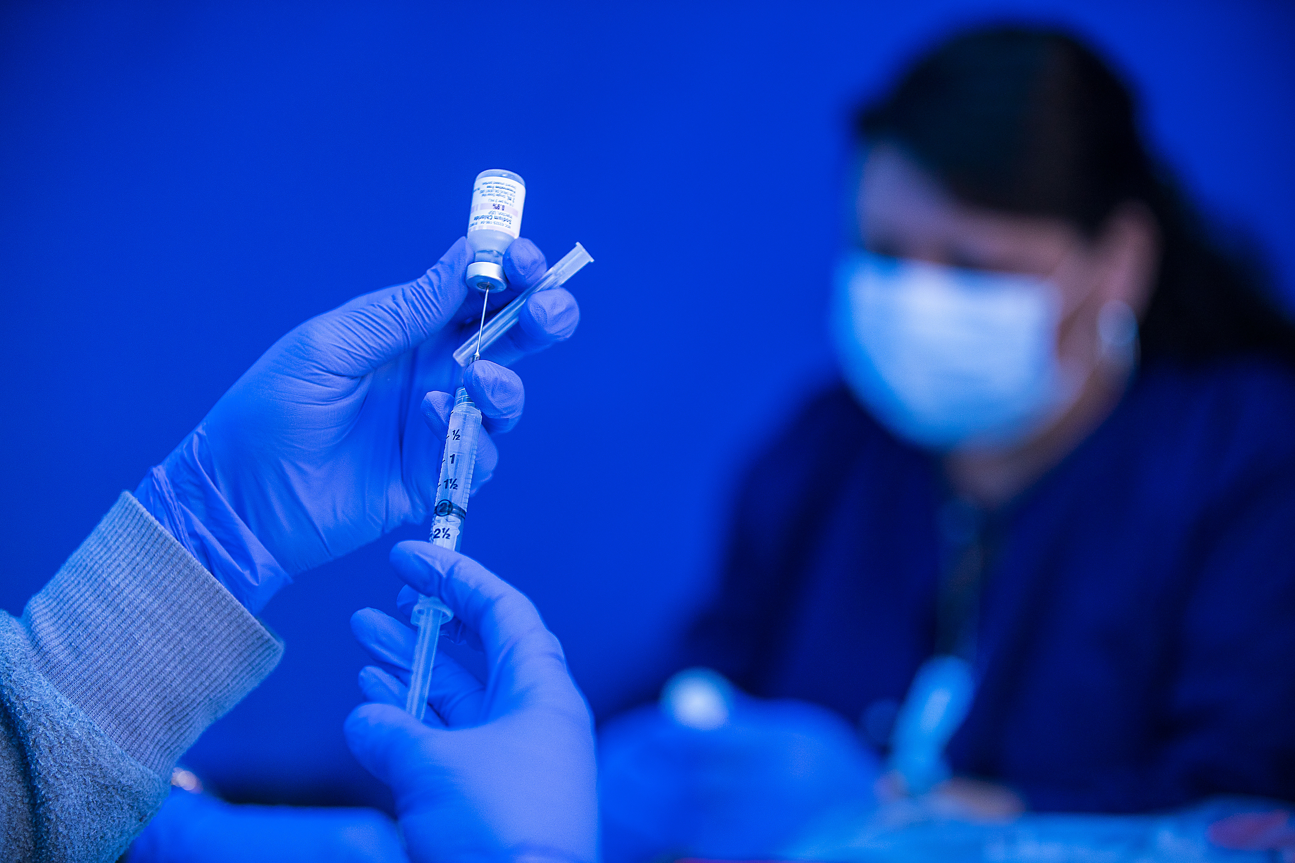 The COVID-19 vaccines are safe and effective, but misinformation keeps many people from taking the shot. (Los Angeles Times via Getty Images)