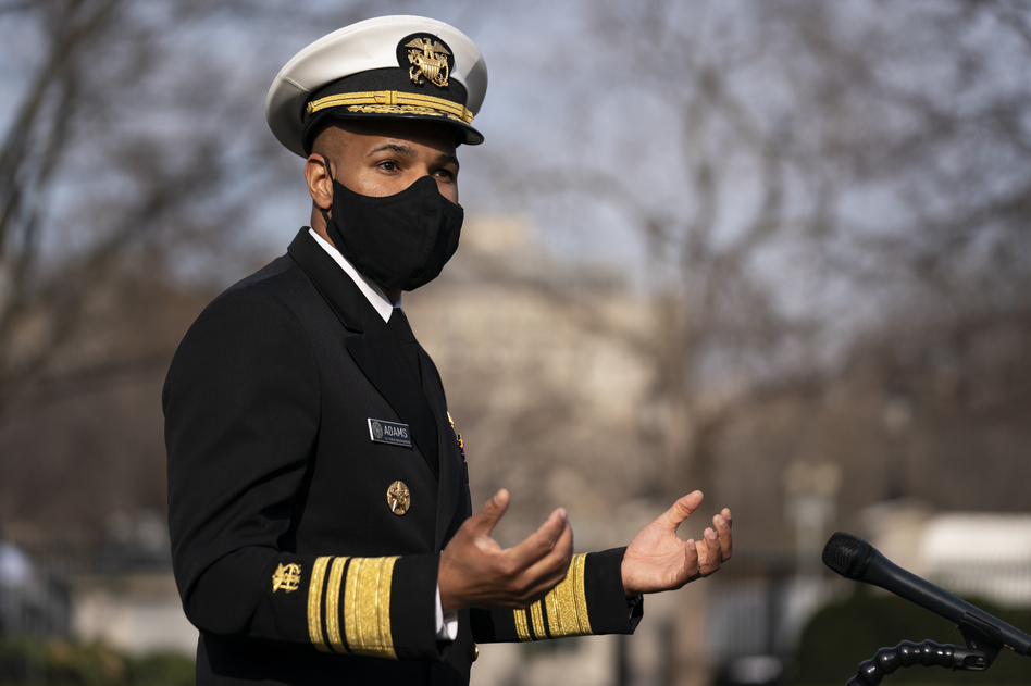 Dr. Jerome Adams, then the U.S. surgeon general, talks to reporters at the White House in December. (Evan Vucci/AP)