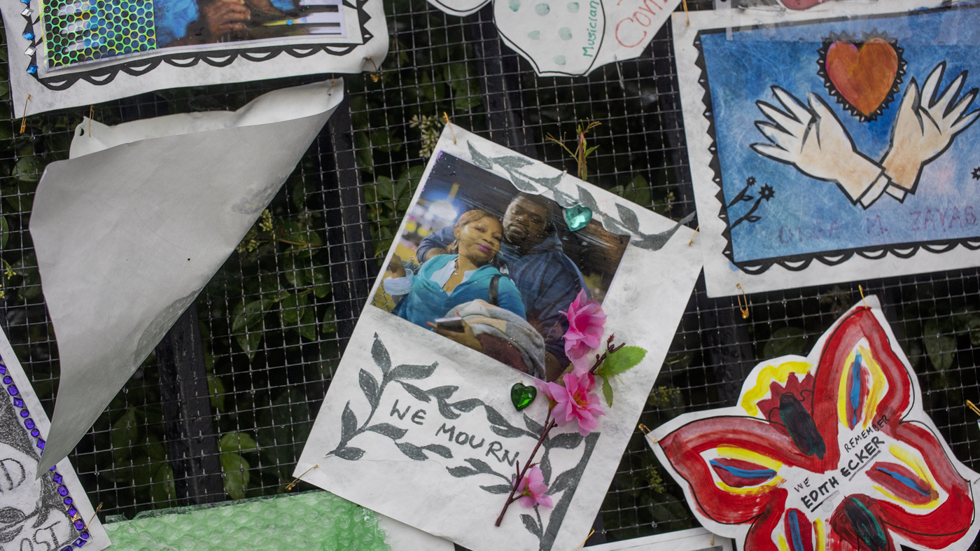                  A fence alongside Greenwood Cemetery, in Brooklyn, N.Y., is covered with memorial art for people who died of COVID-19. Pandemic death