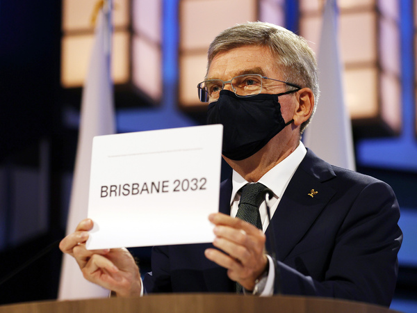 President of the International Olympic Committee Thomas Bach announces Brisbane as the 2032 Summer Olympics host city during the 138th IOC Session at Hotel Okura in Tokyo, Wednesday, July 21, 2021.