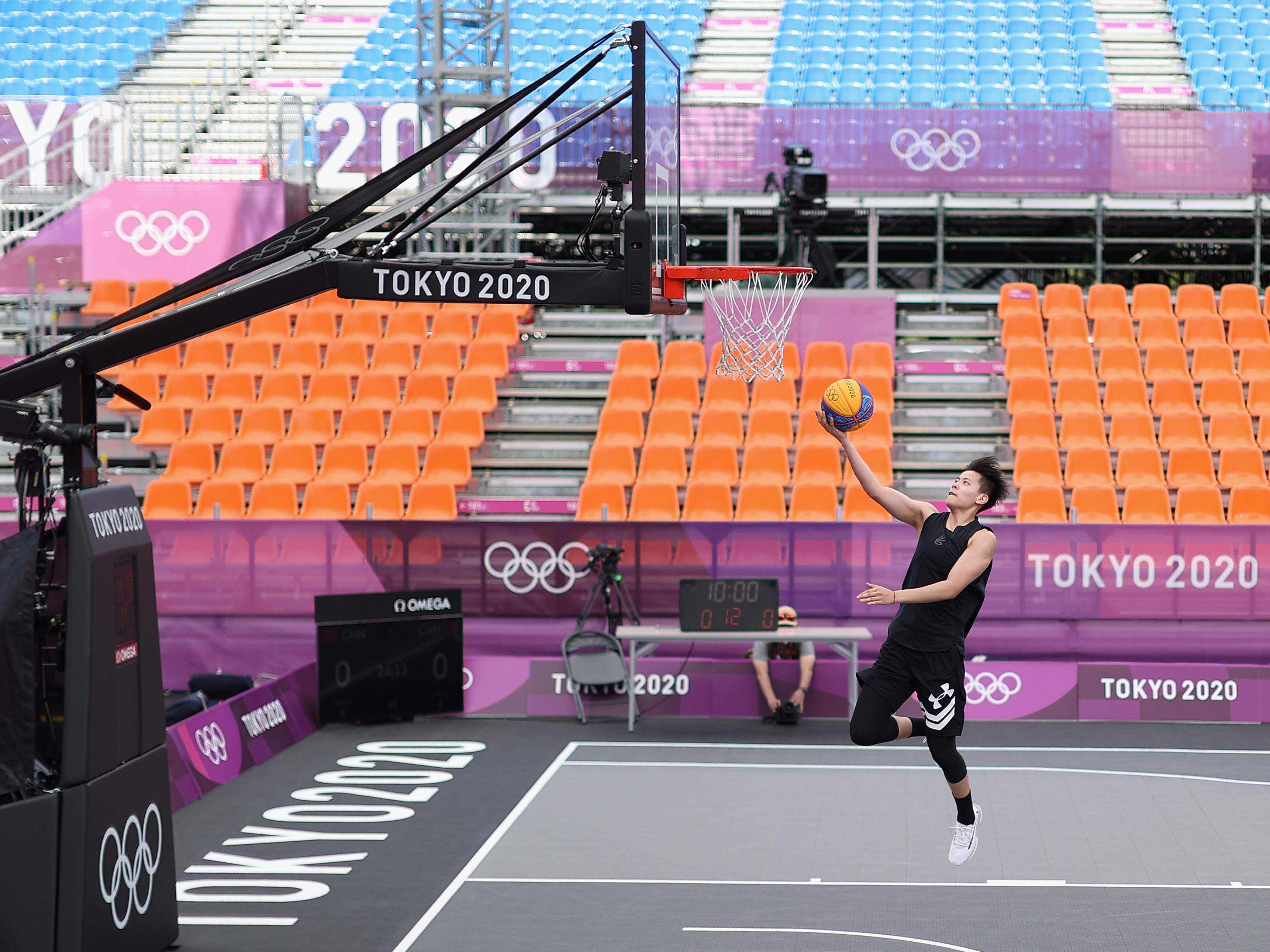 Many Olympic athletes at the Tokyo Summer Games are having to get used to empty stands, the occasional coronavirus quarantine and loneliness. Zhiting Zhang of Team China practices in 3x3 basketball at deserted Aomi Urban Sports Park. (Getty Images)