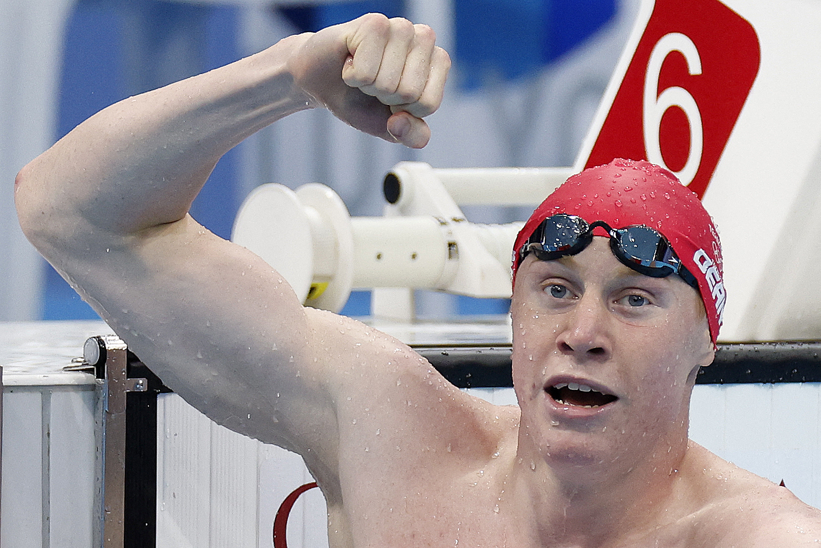 Britain's Tom Dean celebrates winning gold in the men's 200-meter freestyle swimming event at the Tokyo Olympics on Tuesday. (AFP via Getty Images)