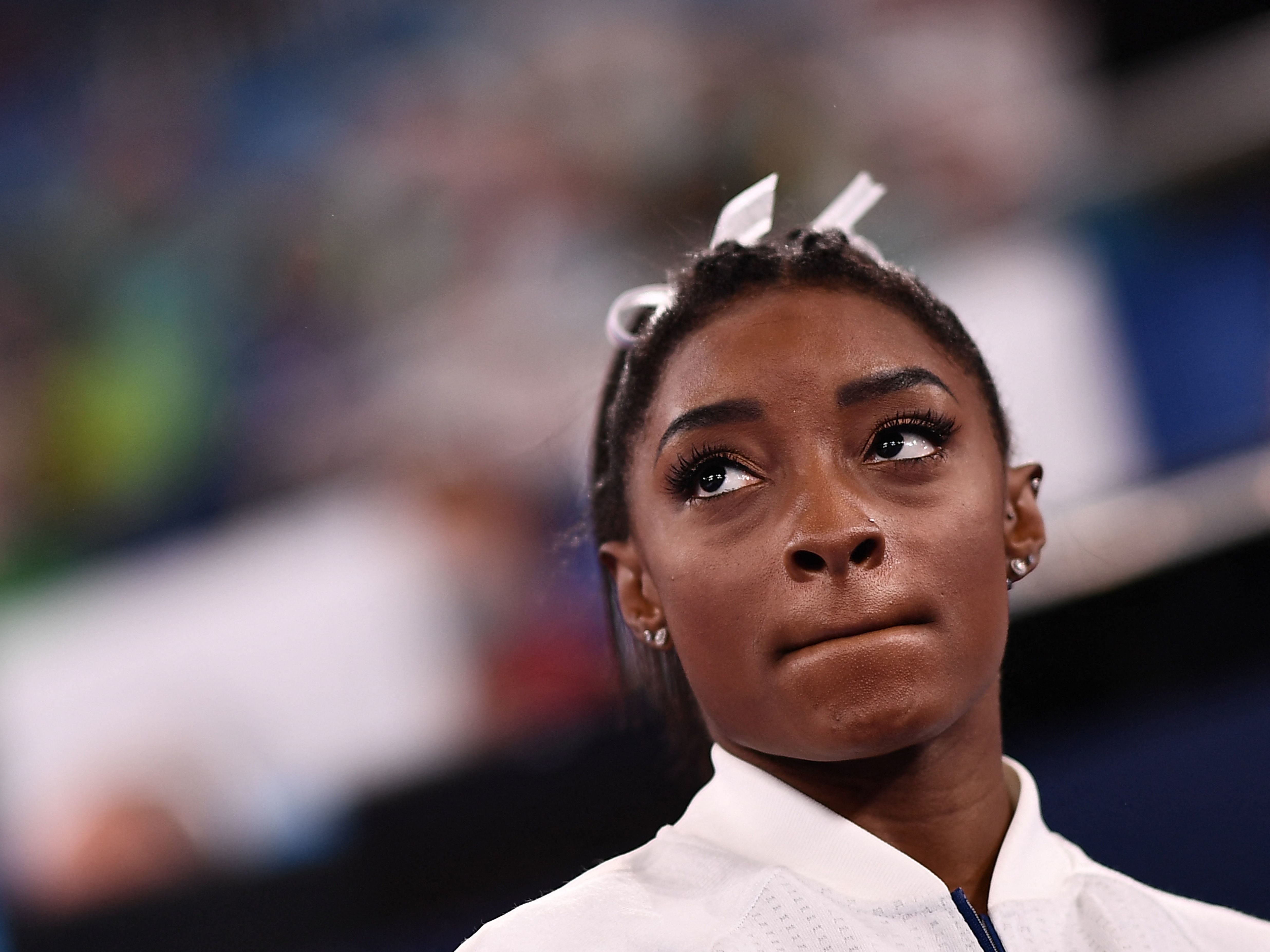 Simone Biles reacts during the artistic gymnastics women's team final Tuesday at the Ariake Gymnastics Centre during the Tokyo Games. (AFP via Getty Images)